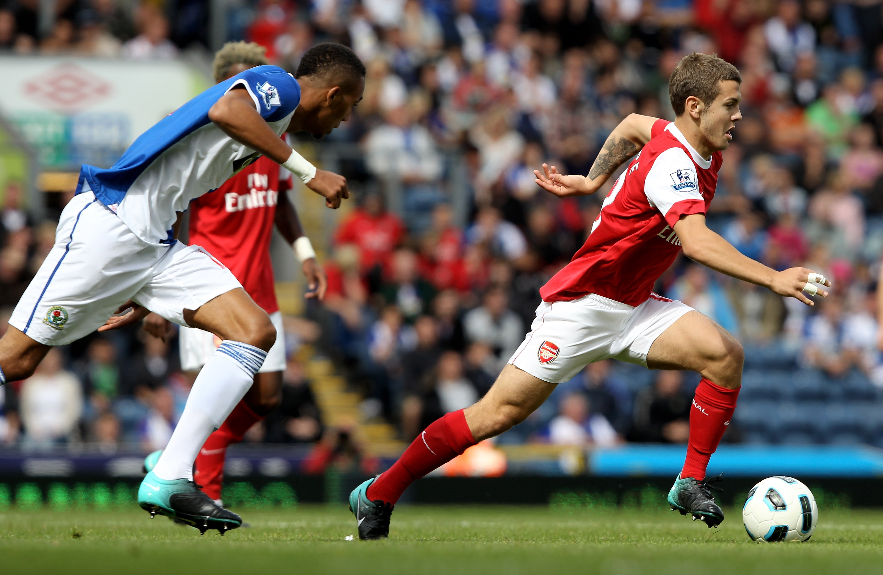 BLACKBURN, ENGLAND - AUGUST 28:  Jack Wilshere of Arsenal moves away from Steven Nzonzi of Blackburn Rovers during the Barclays Premier League match between Blackburn Rovers and Arsenal at Ewood Park on August 28, 2010 in Blackburn, England.  (Photo by Cl