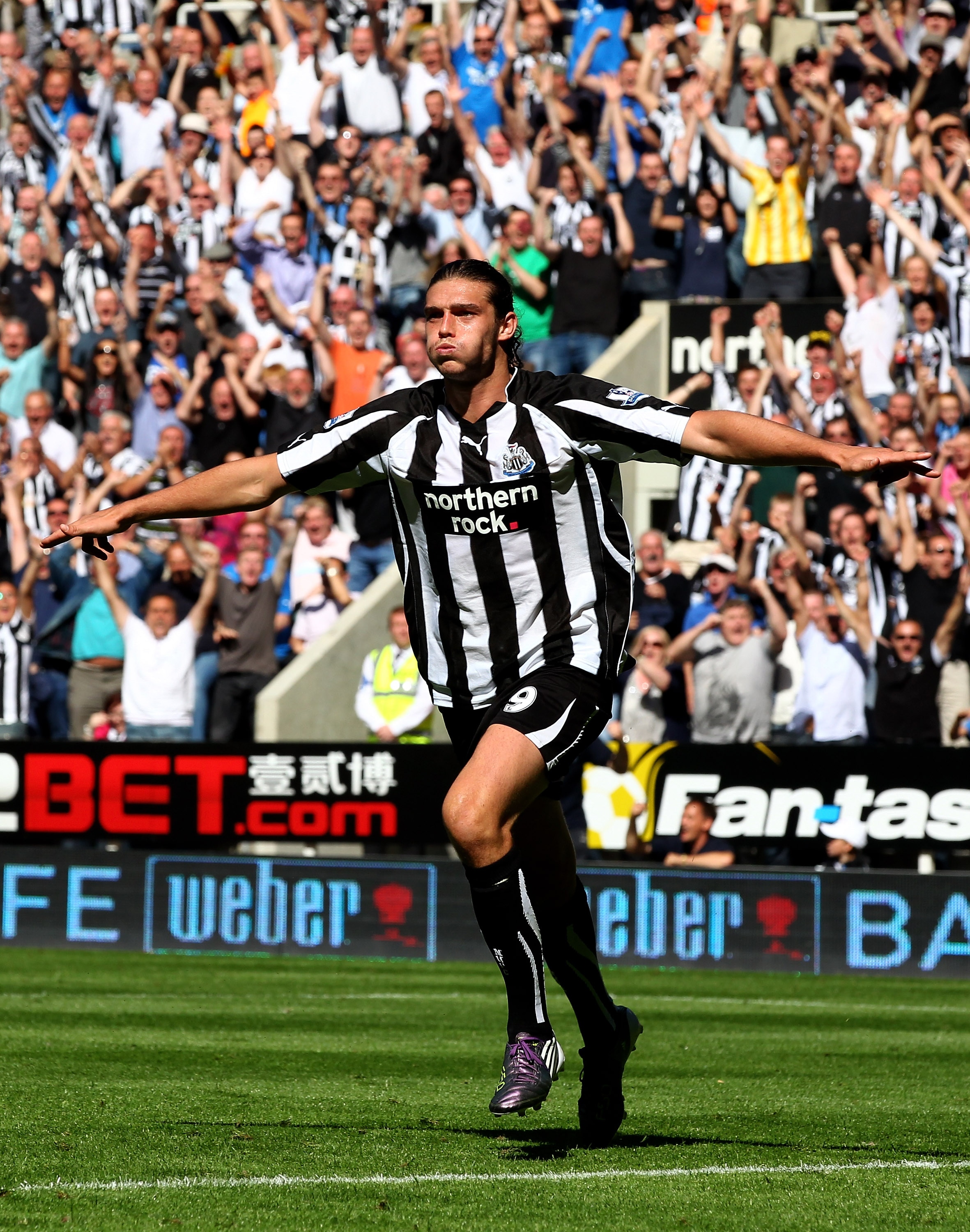NEWCASTLE UPON TYNE, ENGLAND - AUGUST 22: Andy Carroll of Newcastle United celebrates scoring his teams fourth goal during the Barclays Premier League match between Newcastle United and Aston Villa at St James' Park on August 22, 2010 in Newcastle upon T