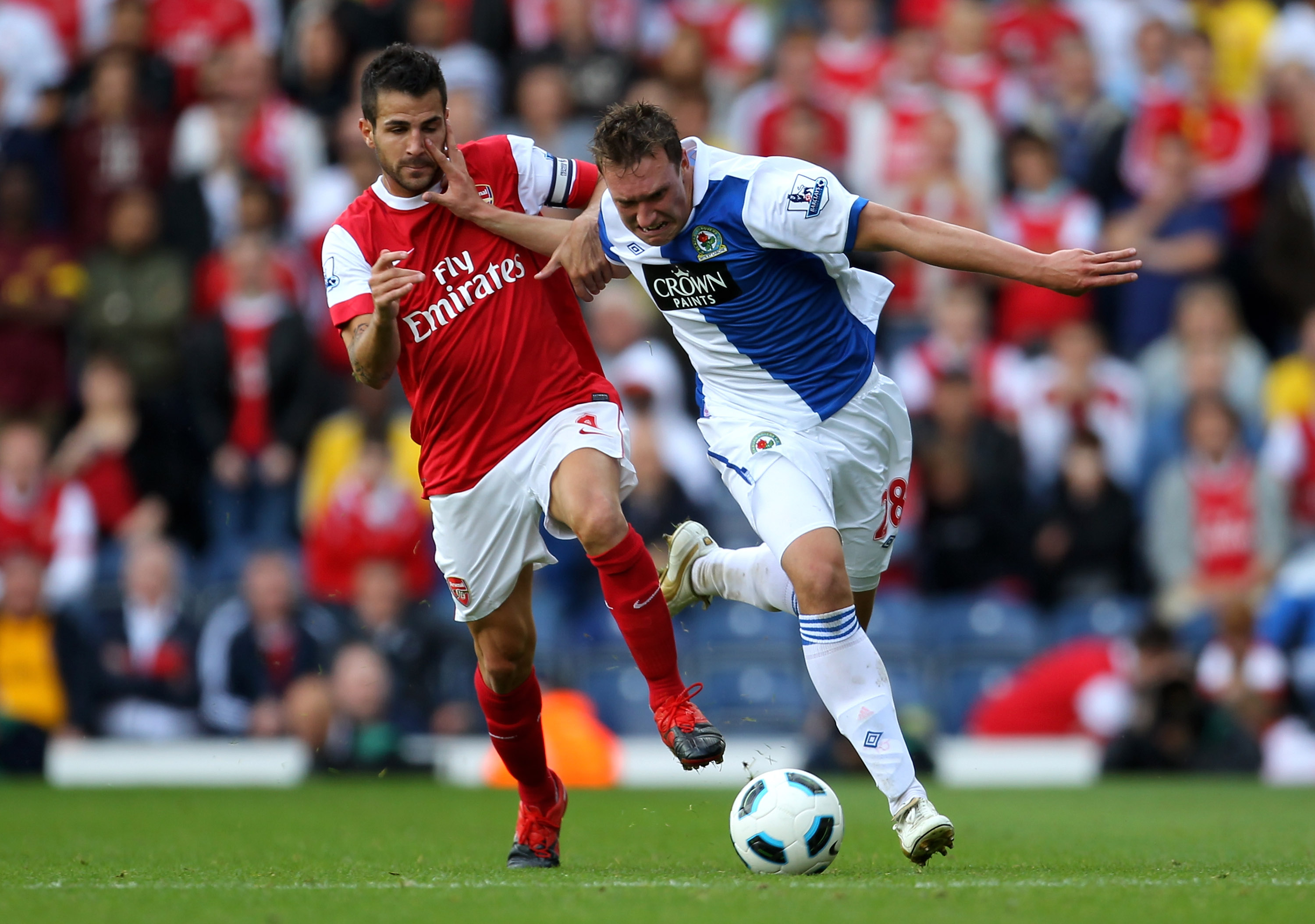 BLACKBURN, ENGLAND - AUGUST 28:  Phil Jones of Blackburn Rovers battles for the ball with Cesc Fabregas of Arsenal during the Barclays Premier League match between Blackburn Rovers and Arsenal at Ewood Park on August 28, 2010 in Blackburn, England.  (Phot