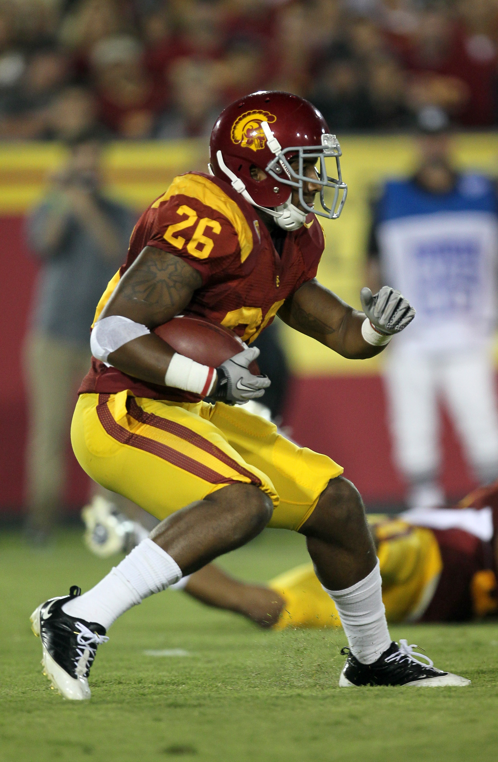 LOS ANGELES, CA - SEPTEMBER 11: Running back Marc Tyler #26 of the USC Trojans carries the ball against the Virginia Cavaliers at Los Angeles Memorial Coliseum on September 11, 2010 in Los Angeles, California. USC won 17-14. (Photo by Stephen Dunn/Getty
