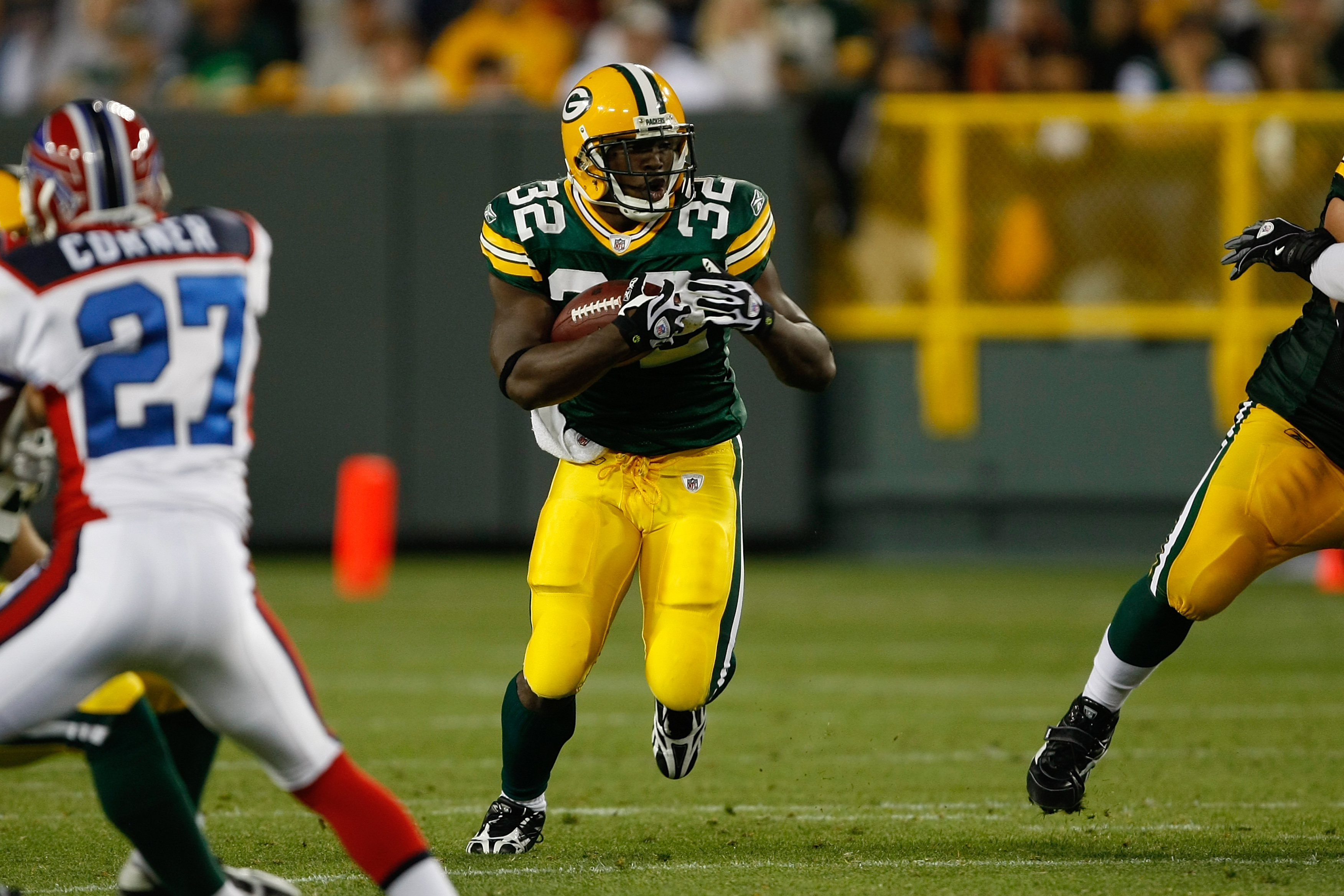 GREEN BAY, WI - AUGUST 22: Running back Brandon Jackson #32 of the Green Bay Packers runs with the football against the Buffalo Bills at Lambeau Field on August 22, 2009 in Green Bay. Wisconsin.  (Photo by Scott Boehm/Getty Images)