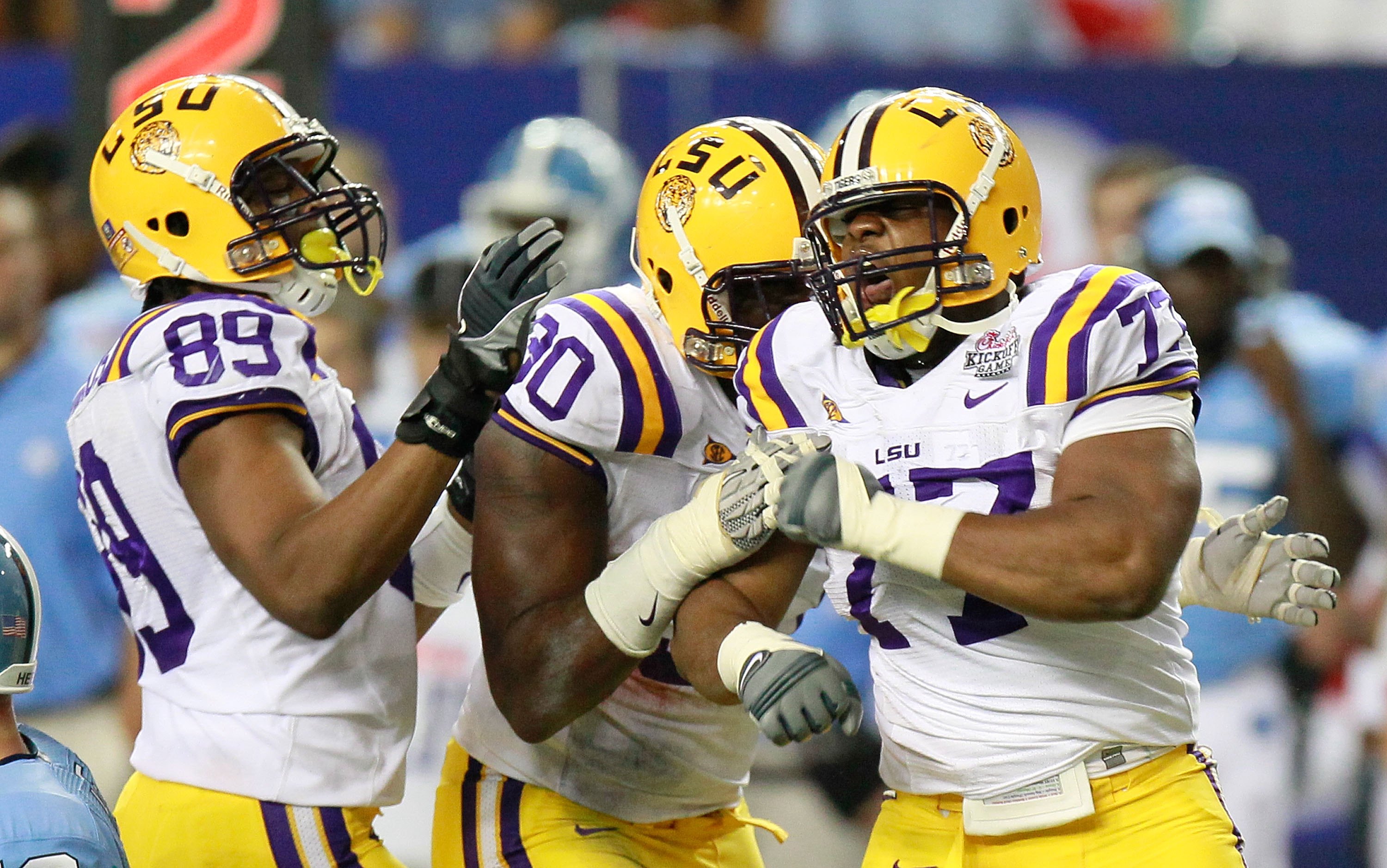 ATLANTA - SEPTEMBER 04: Lavar Edwards #89, Michael Brockers #90 and Josh Downs #77 of the LSU Tigers against the North Carolina Tar Heels during the Chick-fil-A Kickoff Game at Georgia Dome on September 4, 2010 in Atlanta, Georgia. (Photo by Kevin C. Co