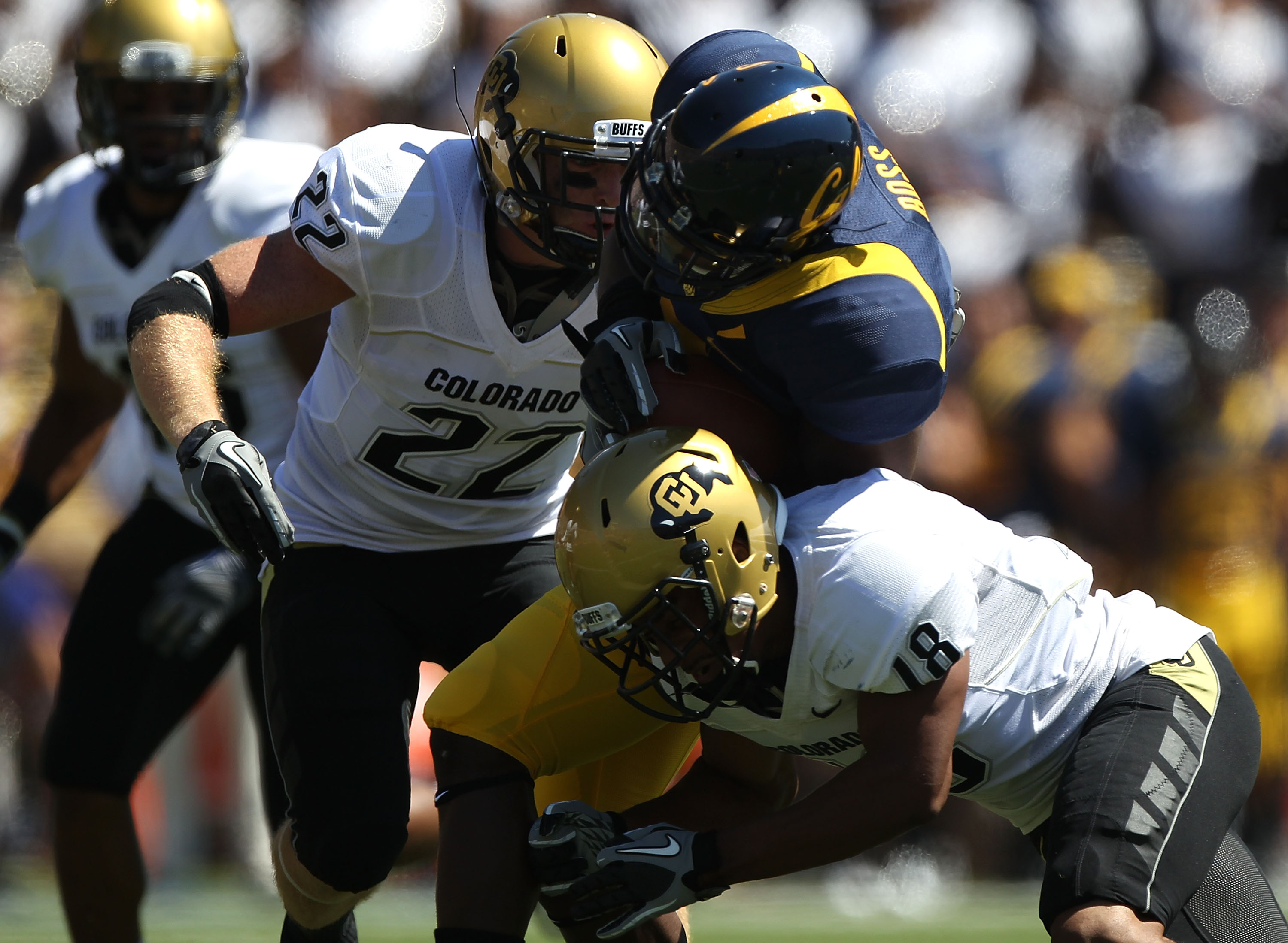 BERKELEY, CA - SEPTEMBER 11: Jeremy Ross #3 of the California Golden Bears runs against Jonathan Hawkins #18 and Arthur Jaffee #22 of the Colorado Buffaloes at California Memorial Stadium on September 11, 2010 in Berkeley, California. (Photo by Jed Jaco