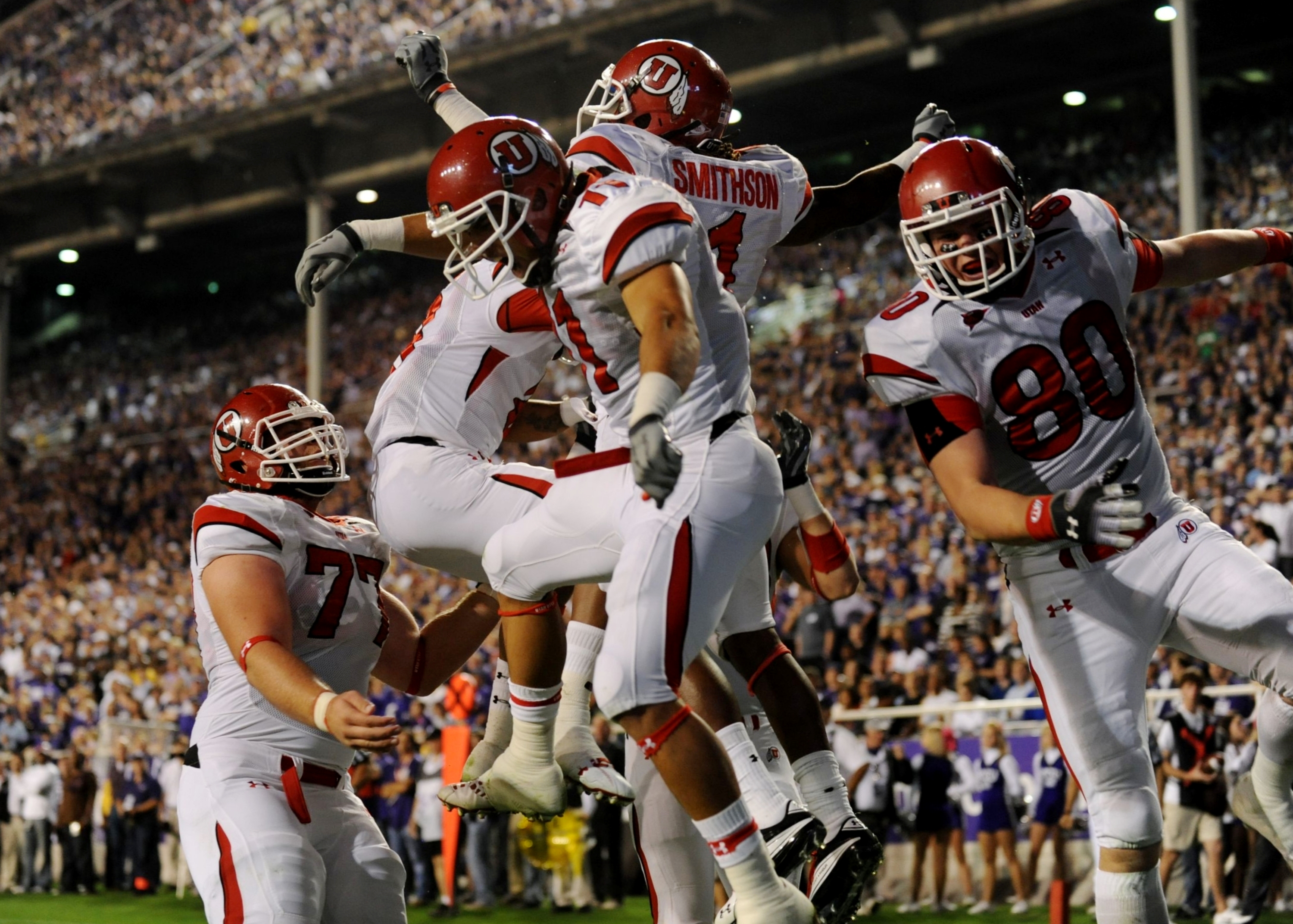 FORT WORTH, TX - NOVEMBER 14: Shaky Smithson #1 of the Utah Utes celebrates with teammates after scoring a touchdown in the first quarter of the game against the TCU Horned Frogs at Amon G. Carter Stadium on November 14, 2009 in Fort Worth, Texas. (Phot
