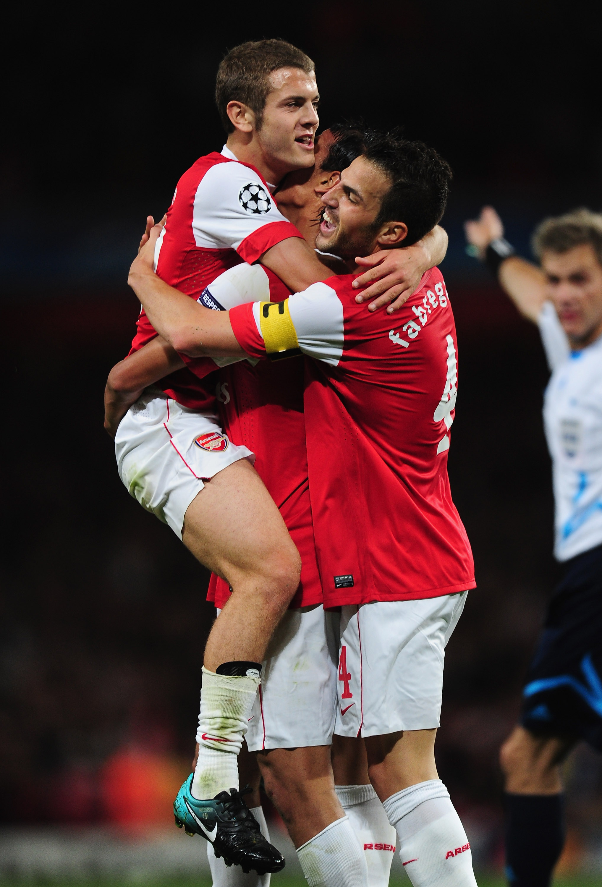 LONDON, ENGLAND - SEPTEMBER 15:  Marouane Chamakh of Arsenal celebrates with team mate Jack Wilshere after scoring during the UEFA Champions League Group H match between Arsenal and SC Braga at the Emirates Stadium on September 15, 2010 in London, England