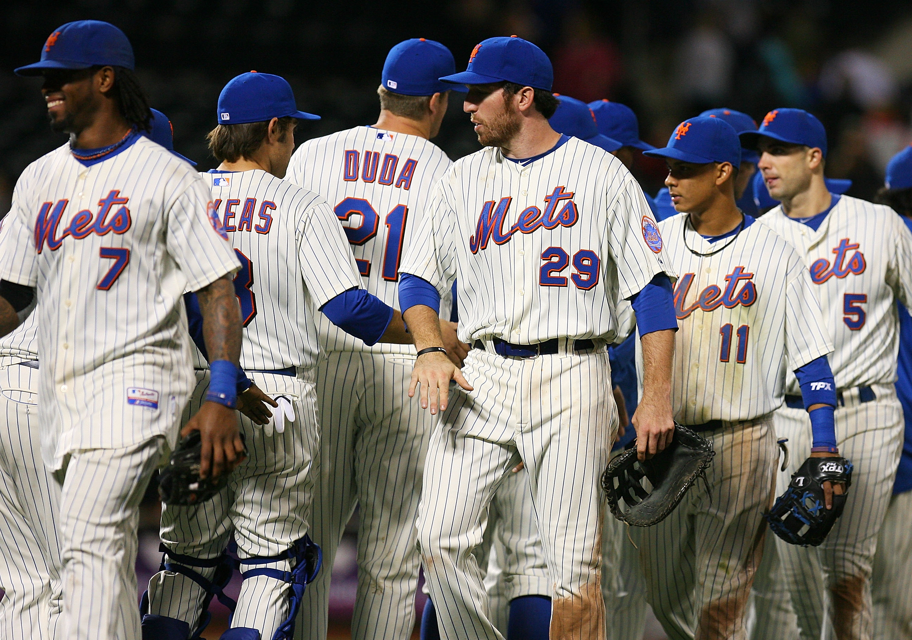 NEW YORK - SEPTEMBER 15:  The New York Mets give each other high-fives after beating the Pittsburgh Pirates 8 - 7 on September 15, 2010 at Citi Field in the Flushing neighborhood of the Queens borough of New York City.  (Photo by Andrew Burton/Getty Image