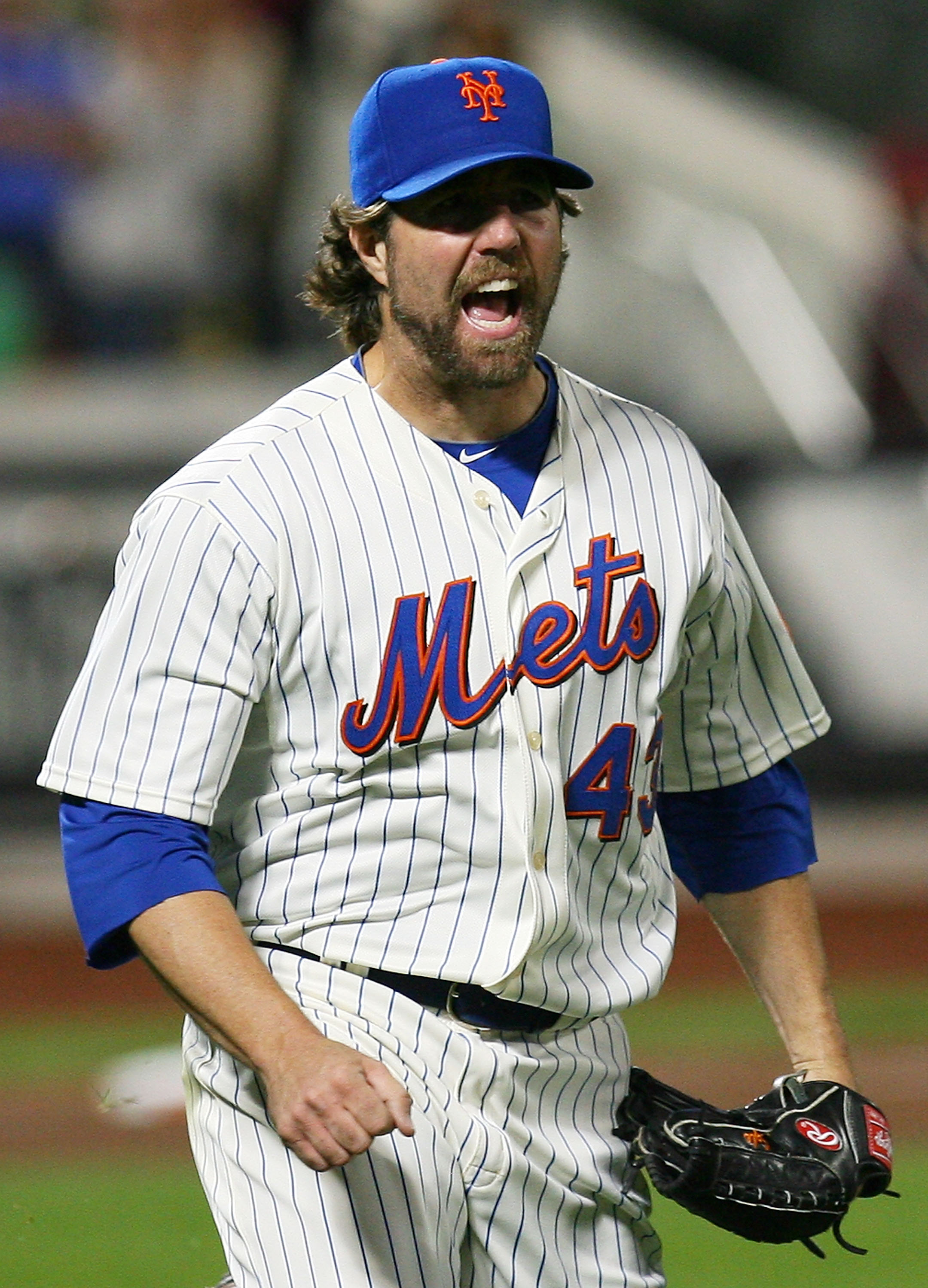 NEW YORK - SEPTEMBER 14: R.A. Dickey #43 of the New York Mets celebrates after beating the Pittsburgh Pirates 9-1 on September 14, 2010 at Citi Field in the Flushing neighborhood of the Queens borough of New York City.  (Photo by Andrew Burton/Getty Image