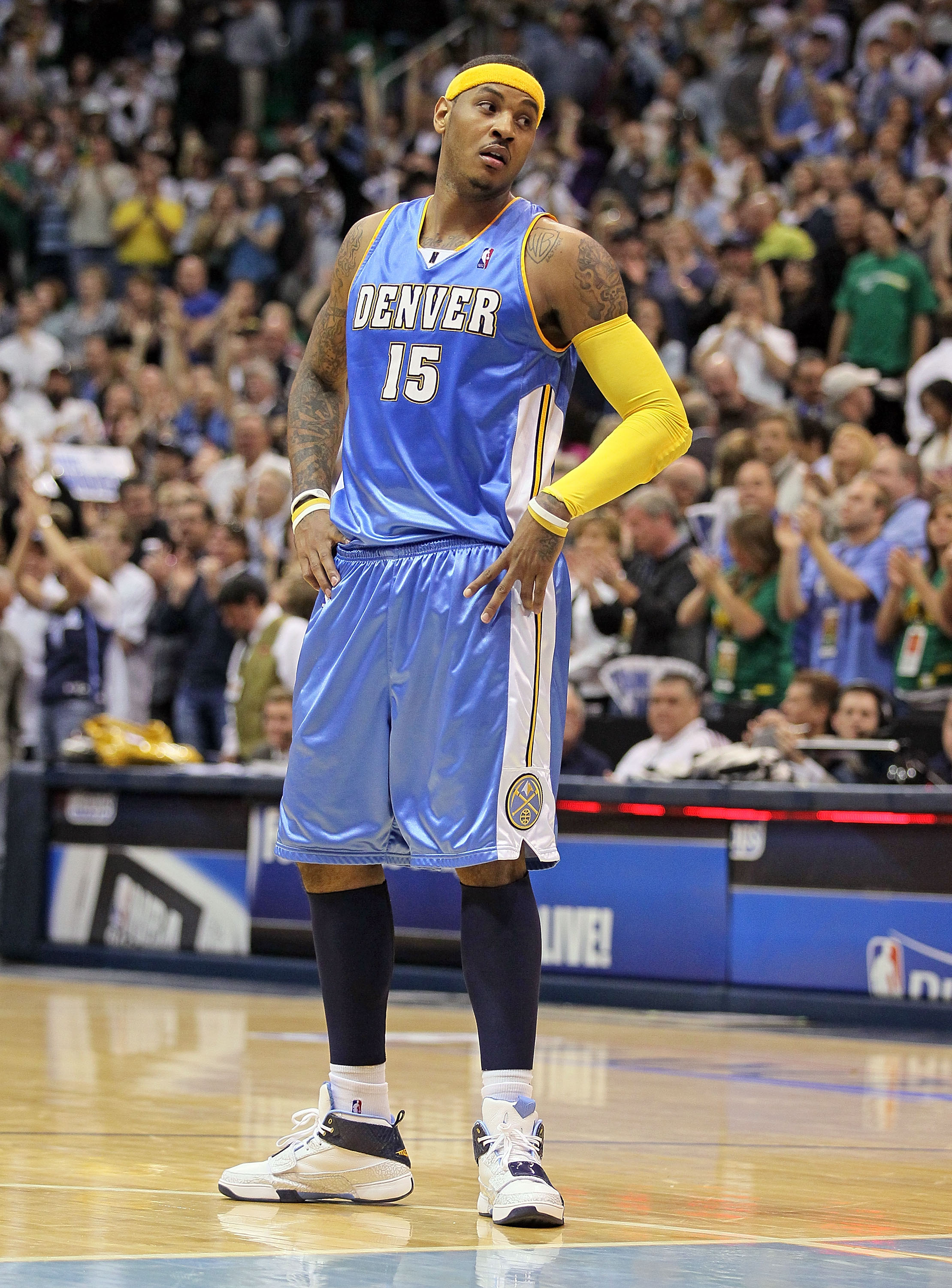 Houston Rockets forward Tracy McGrady (L) fouls Denver Nuggets forward  Carmelo Anthony in the fourth quarter at the Pepsi Center in Denver March  2, 2007. McGrady scored 28 points and Anthony scored