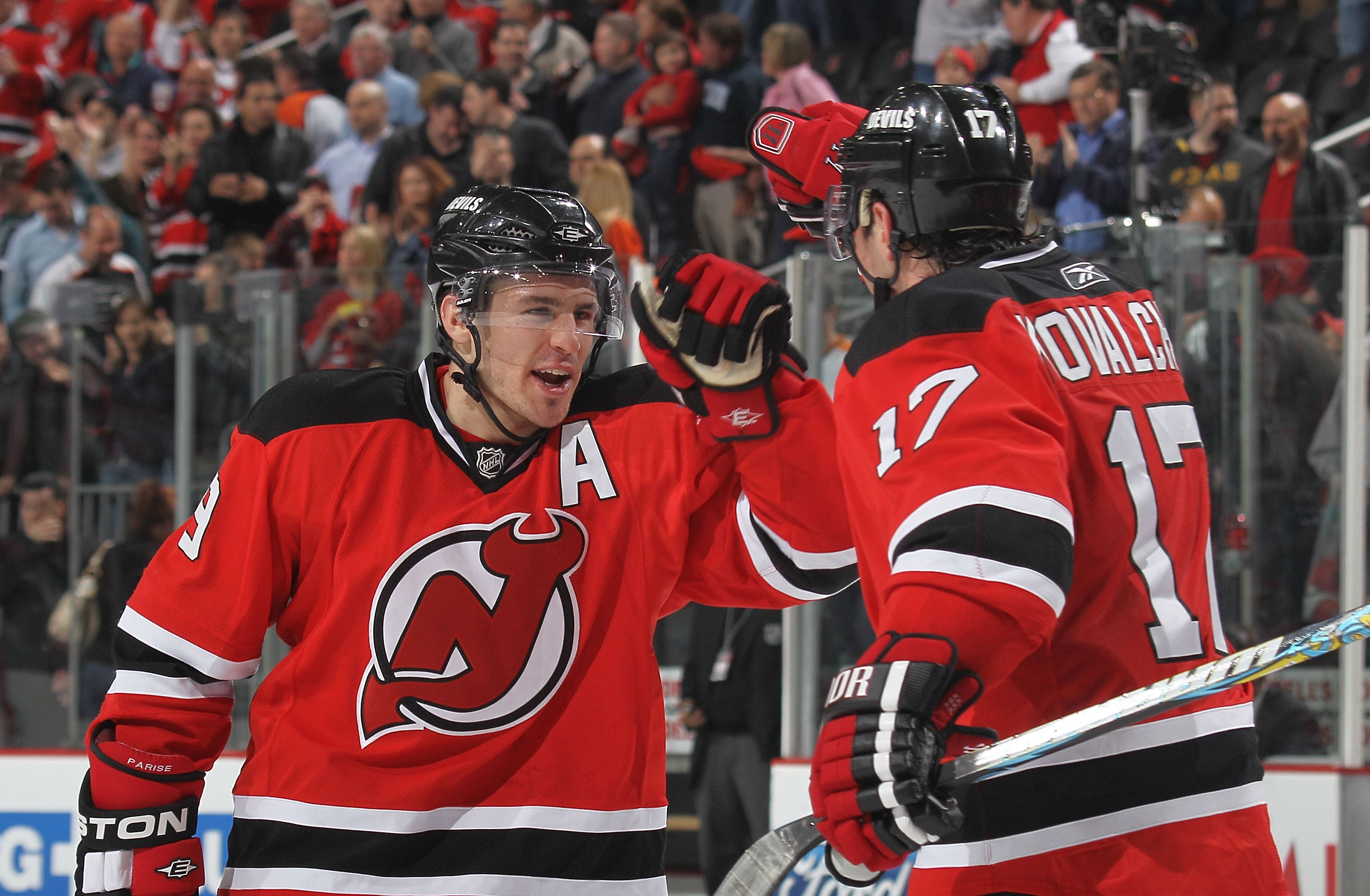 NEWARK, NJ - APRIL 16: Zach Parise #9 and Ilya Kovachuk #17 of the New Jersey Devils celebrate their 5-3 victory over the Philadelphia Flyers in Game Two of the Eastern Conference Quarterfinals during the 2010 NHL Stanley Cup Playoffs at the Prudential Ce