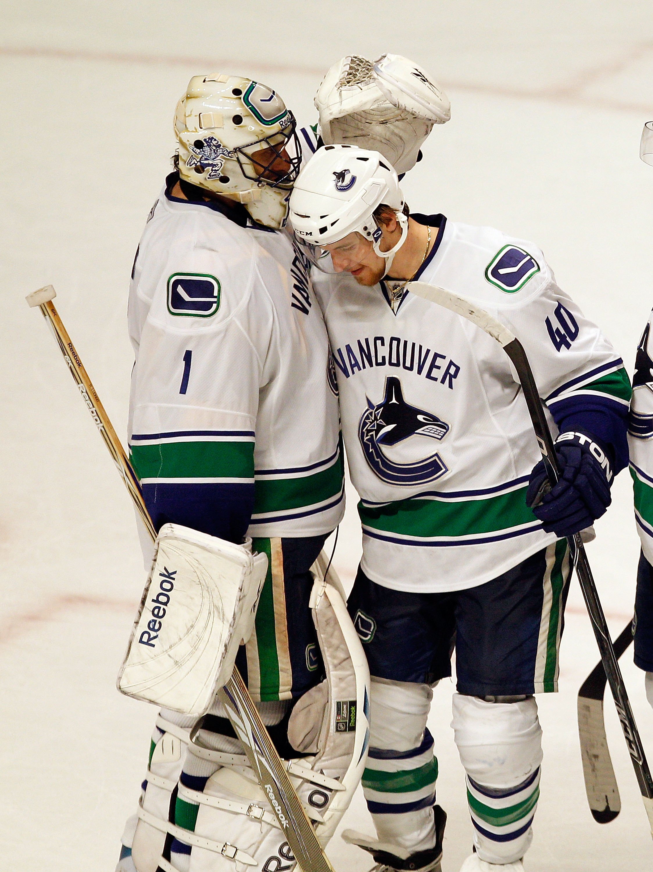 CHICAGO - MAY 09: Roberto Luongo #1 of the Vancouver Canucks is congratulated by Michael Grabner #40 after a win over the Chicago Blackhawks in Game Five of the Western Conference Semifinals during the 2010 NHL Stanley Cup Playoffs at United Center on May
