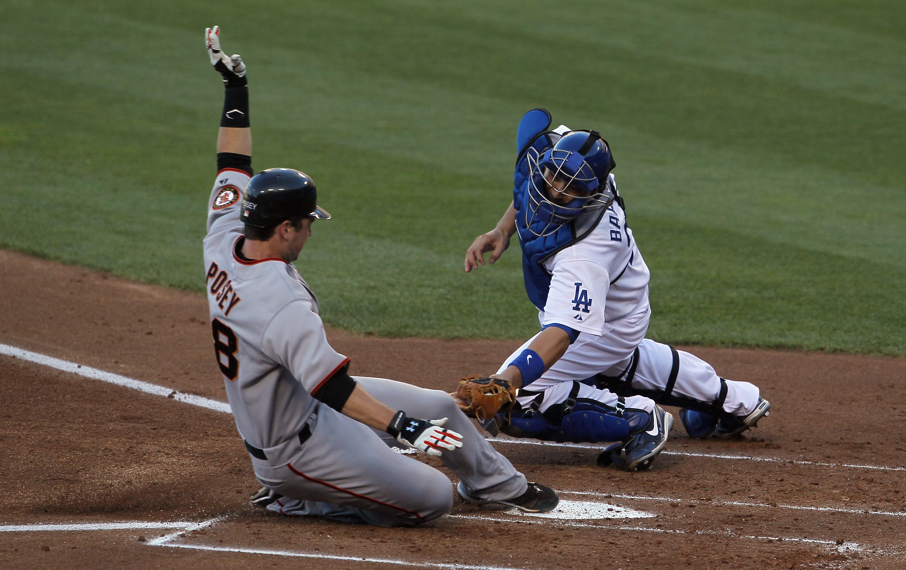 Los Angeles Dodgers' Rod Barajas, below Atlanta Braves second