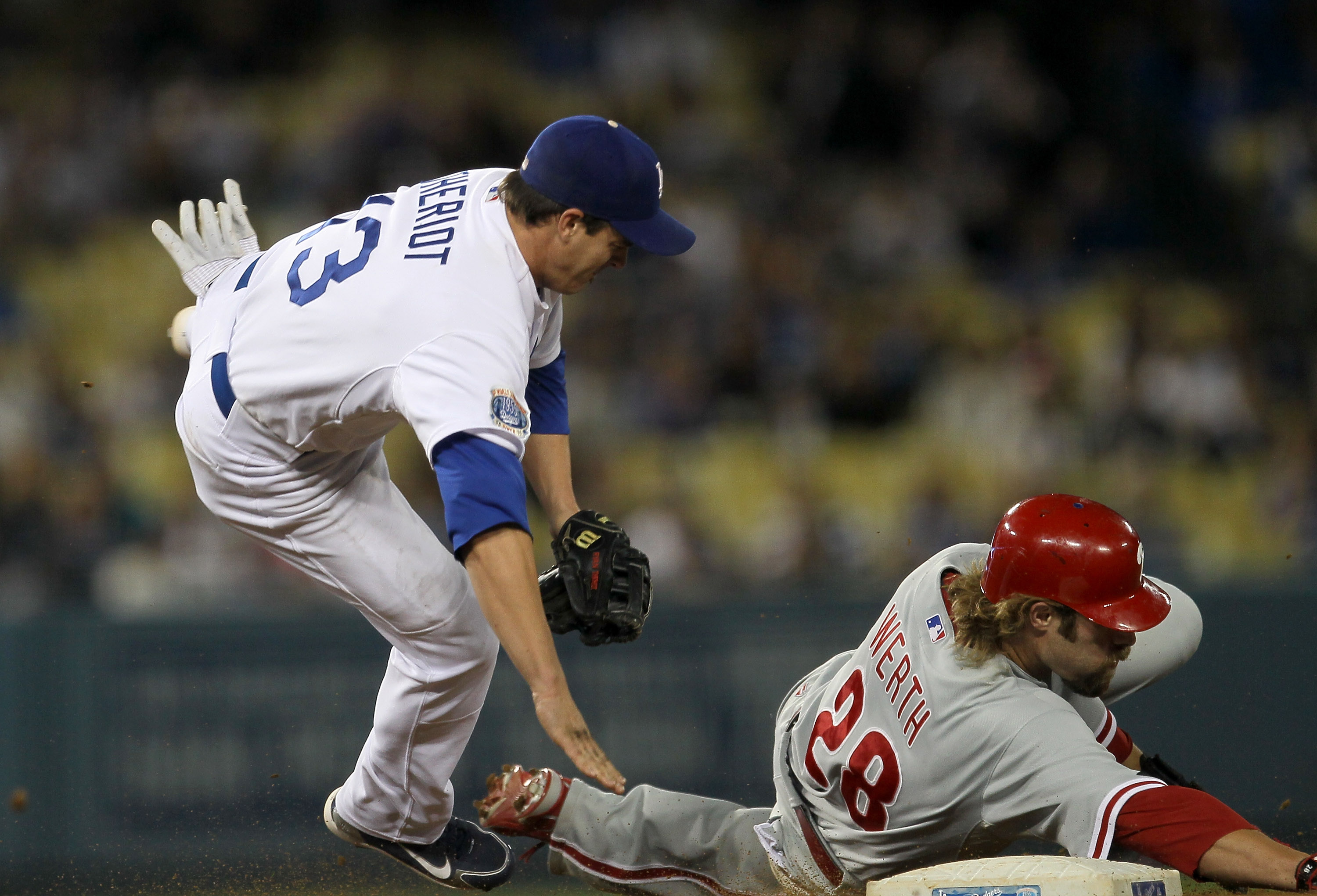 Los Angeles Dodgers' Rod Barajas, below Atlanta Braves second