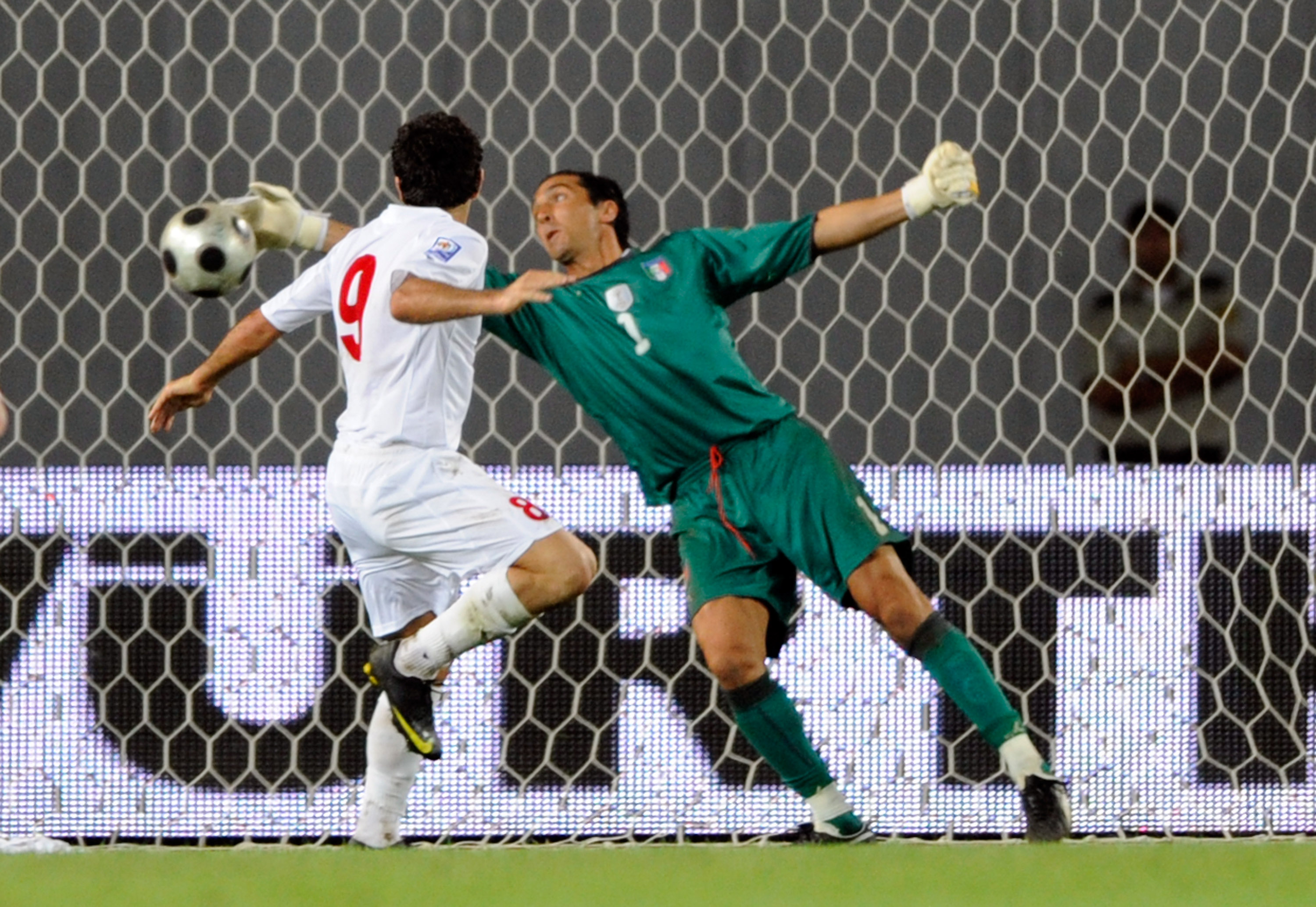 TBILISI, GEORGIA - SEPTEMBER 05: Gianluigi Buffon of Italy and Vladimer Dvalishvili of Georgia defends the goal during the FIFA 2010 World Cup Qualifier match between Georgia and Italy at Boris Paichadze National Stadium on September 5, 2009 in Tbilisi, G