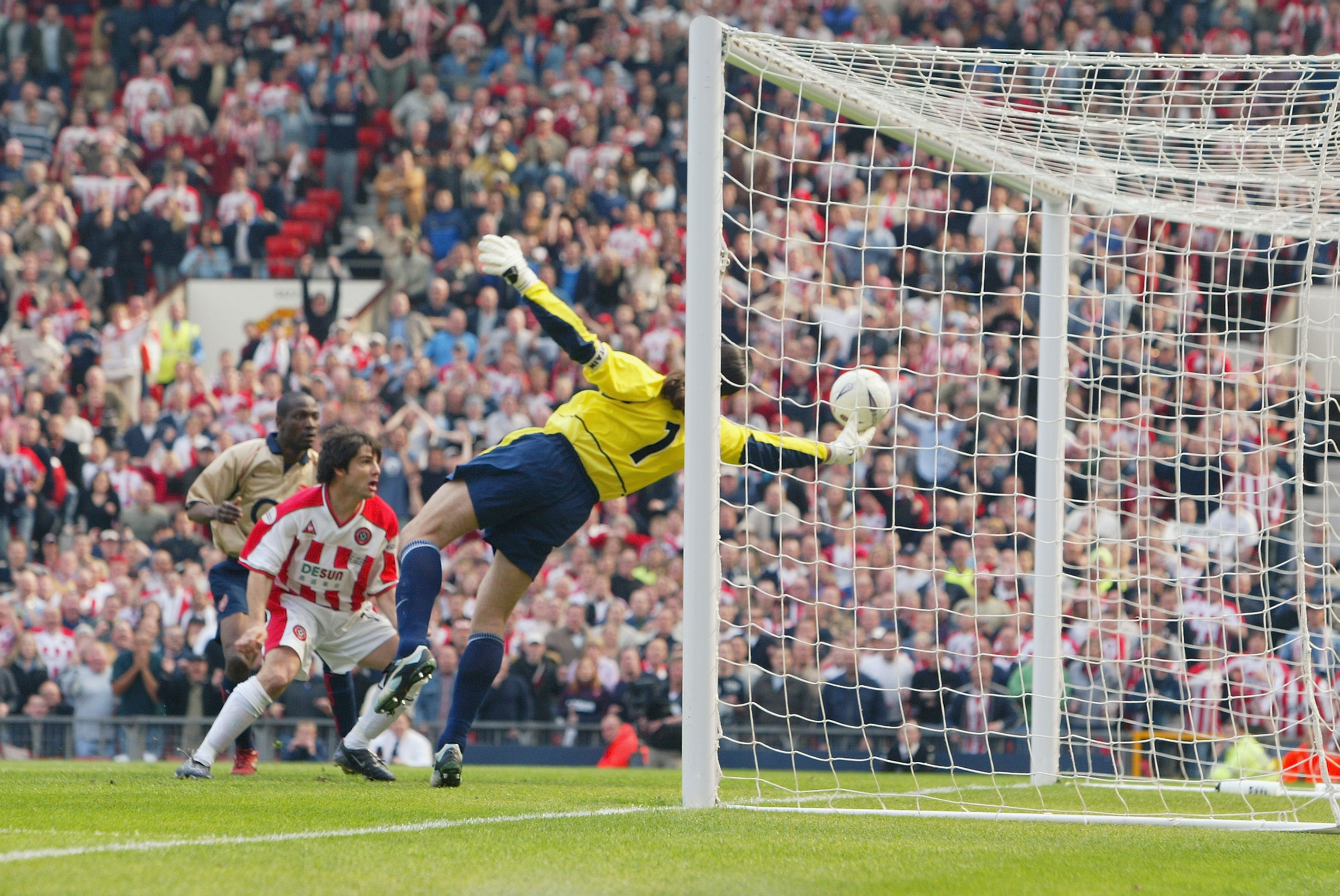 MANCHESTER - APRIL 13:  (FILE PHOTO) David Seaman of Arsenal makes a spectacular save to keep the ball out during the FA Cup Semi-Final match between Arsenal and Sheffield United held on April 13, 2003 at Old Trafford, in Manchester, England. David Seaman