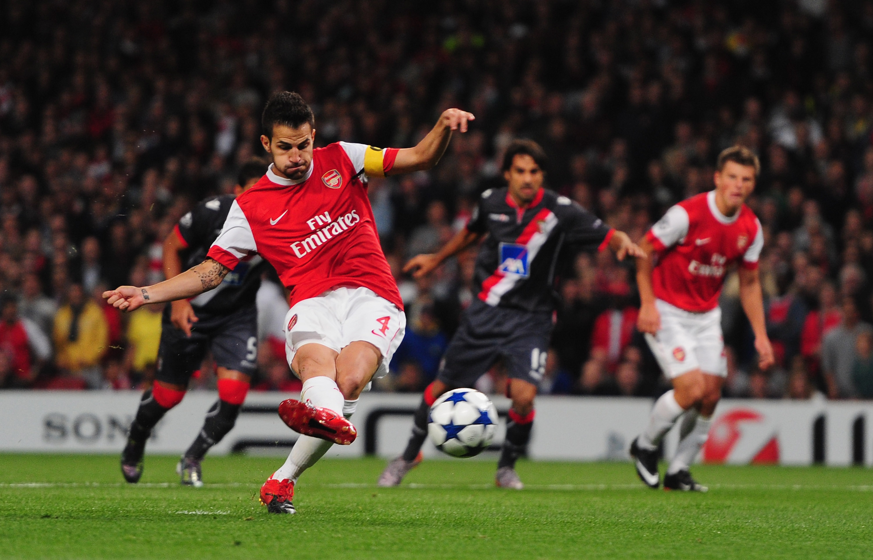 LONDON, ENGLAND - SEPTEMBER 15:  Cesc Fabregas of Arsenal scores from the penalty spot during the UEFA Champions League Group H match between Arsenal and SC Braga at the Emirates Stadium on September 15, 2010 in London, England.  (Photo by Mike Hewitt/Get