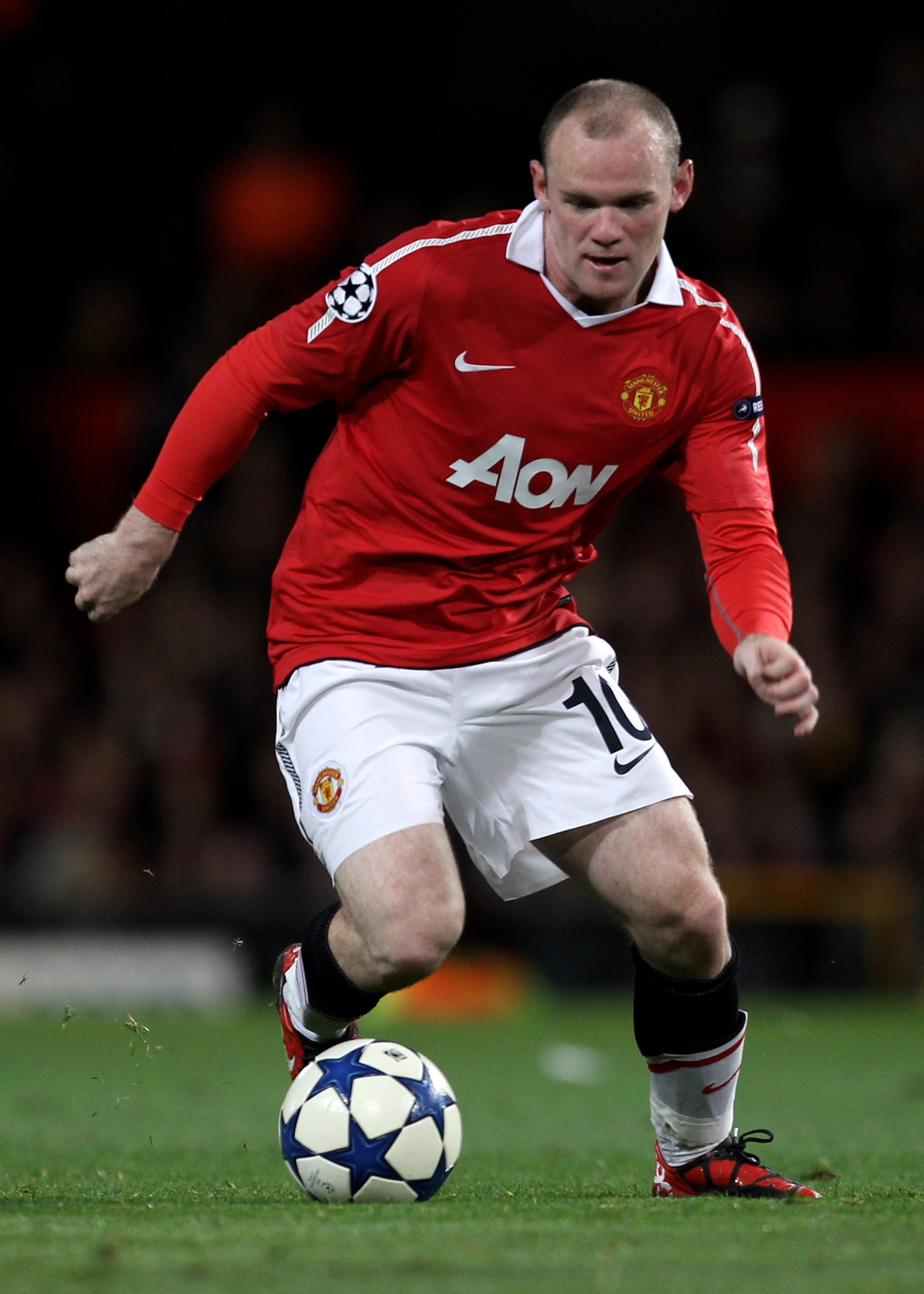 MANCHESTER, ENGLAND - SEPTEMBER 14:  Wayne Rooney of Manchester United in action during the UEFA Champions League Group C match between Manchester United and Rangers at Old Trafford on September 14, 2010 in Manchester, England.  (Photo by Alex Livesey/Get