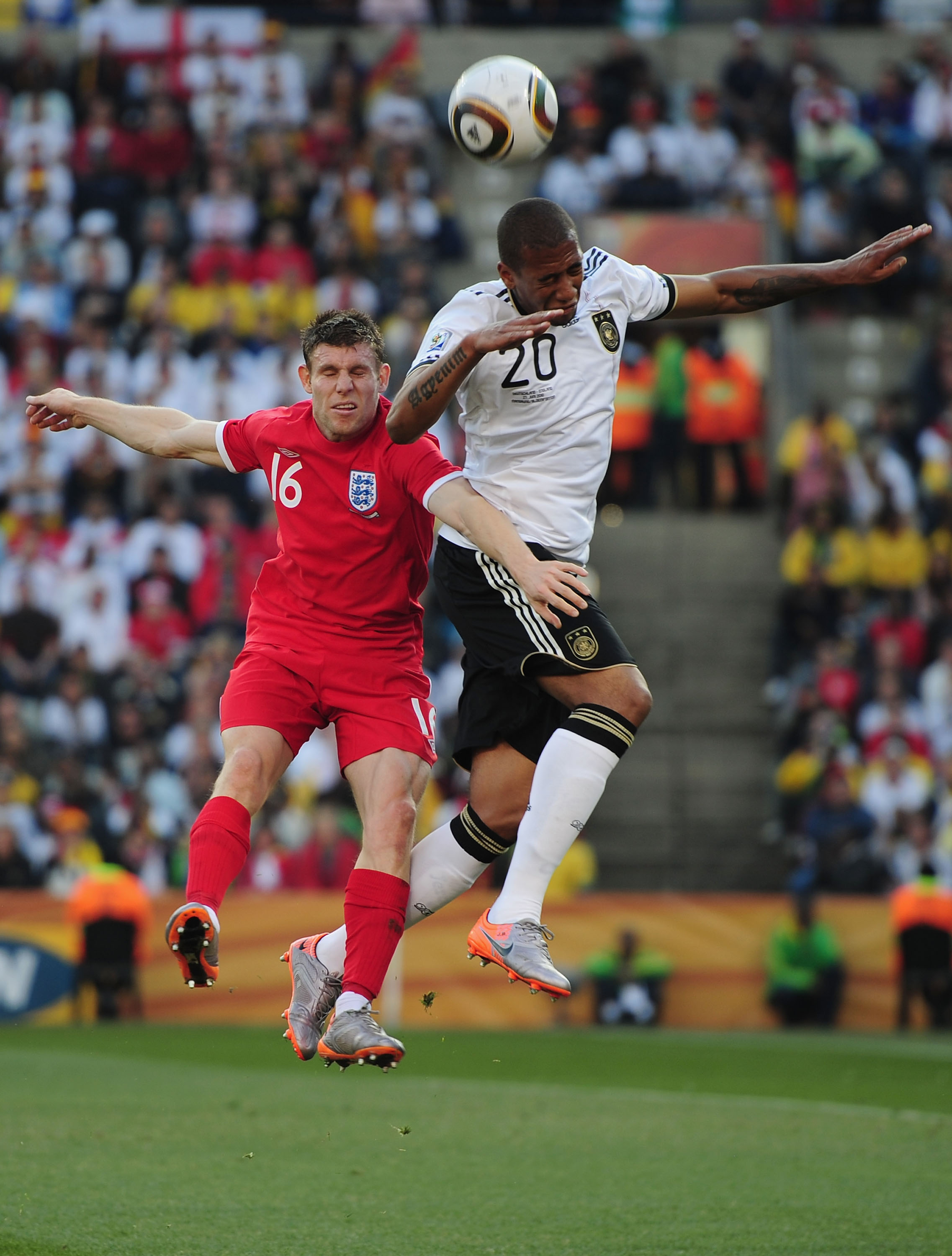 BLOEMFONTEIN, SOUTH AFRICA - JUNE 27: James Milner of England and Jerome Boateng of Germany jump for the ball during the 2010 FIFA World Cup South Africa Round of Sixteen match between Germany and England at Free State Stadium on June 27, 2010 in Bloemfon