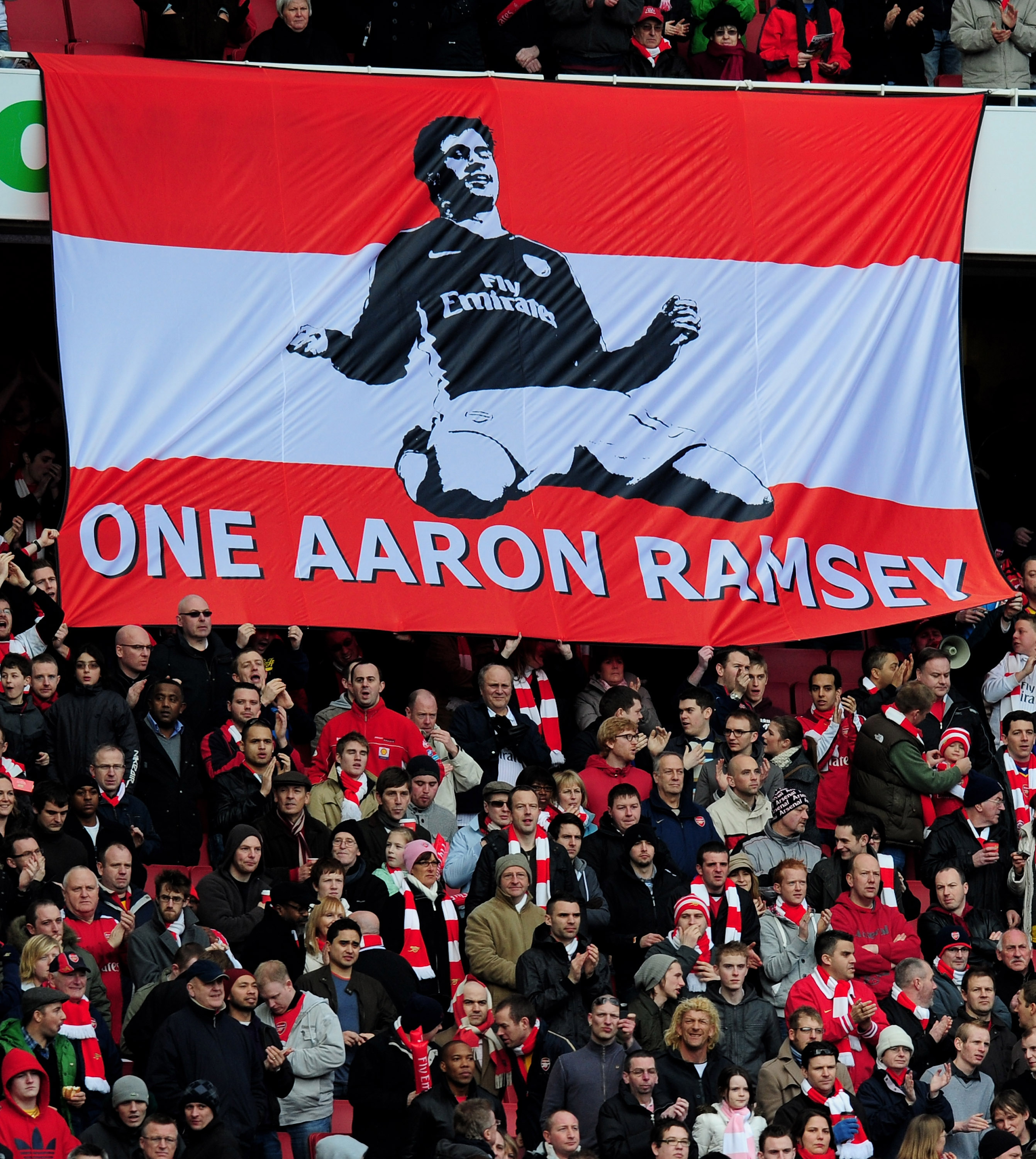 LONDON, ENGLAND - MARCH 06:  Arsenal fan unfurl a banner in support of the injured Aaron Ramsey prior to the Barclays Premier League match between Arsenal and Burnley at Emirates Stadium on March 6, 2010 in London, England.  (Photo by Mike Hewitt/Getty Im