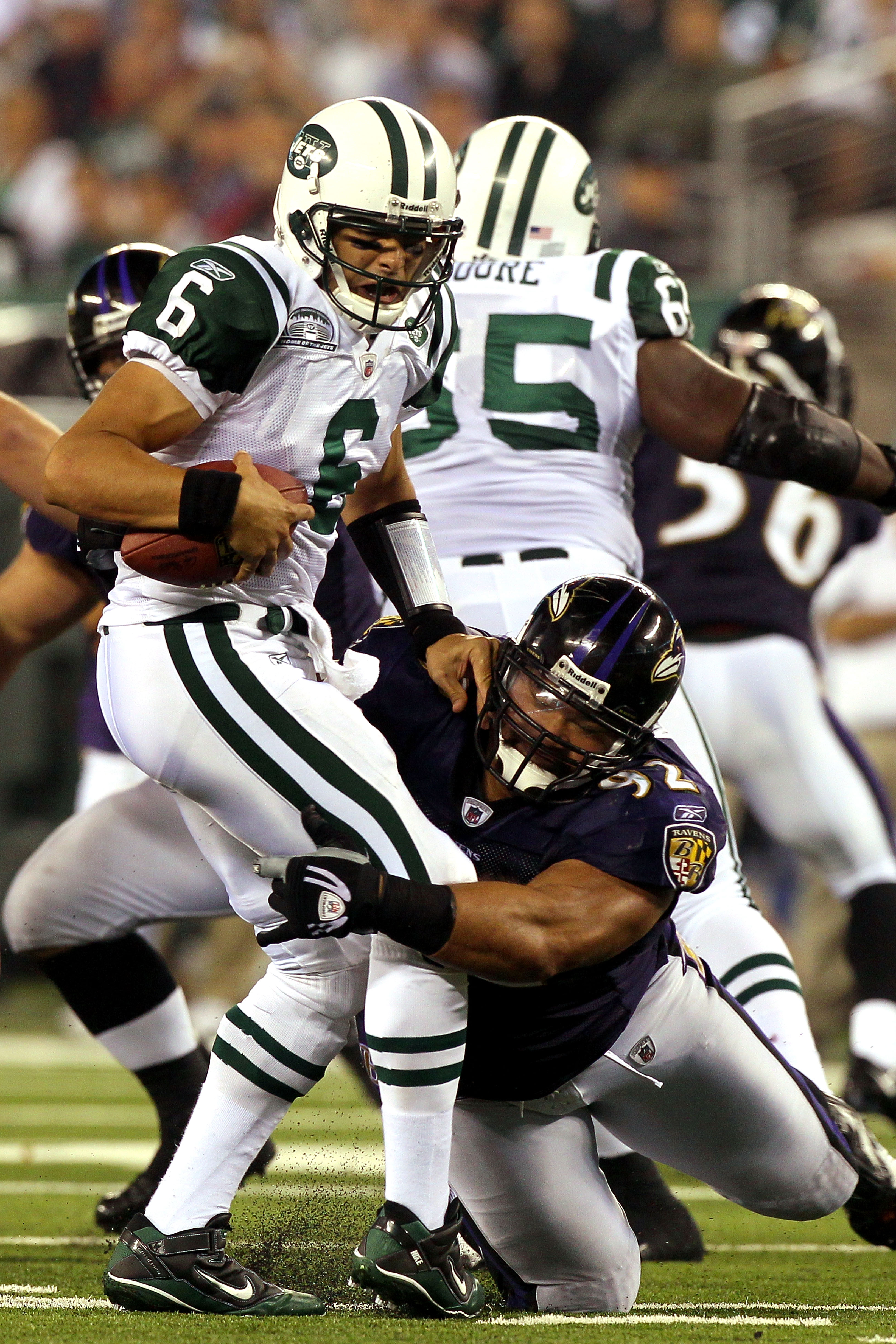 EAST RUTHERFORD, NJ - SEPTEMBER 13:  Mark Sanchez #6 of the New York Jets gets sacked by Haloti Ngata #92 of the Baltimore Ravens during their home opener at the New Meadowlands Stadium on September 13, 2010 in East Rutherford, New Jersey.  (Photo by Jim 