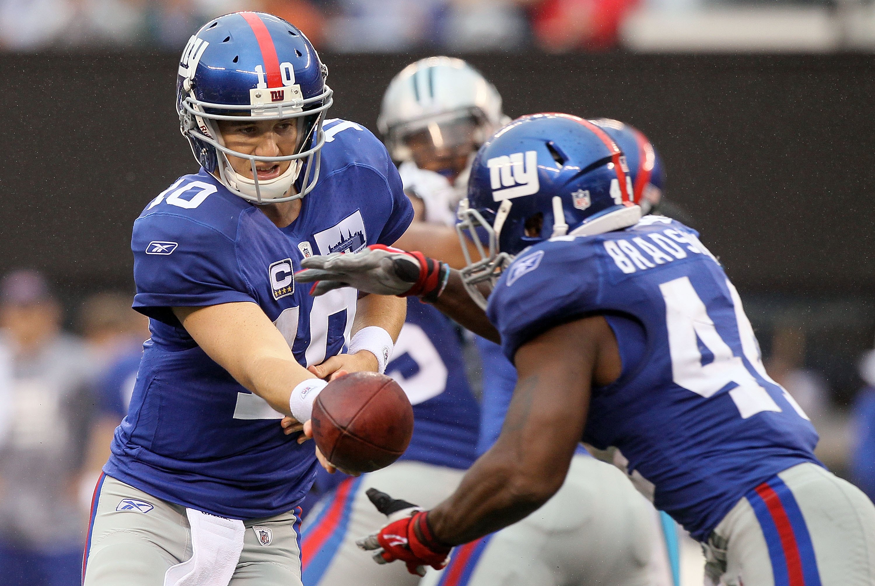 New York Giants Eli Manning throws a pass during week 1 at Giants Stadium  in East Rutherford, New Jersey on September 10, 2006. Peyton Manning and Eli  Manning played each other for