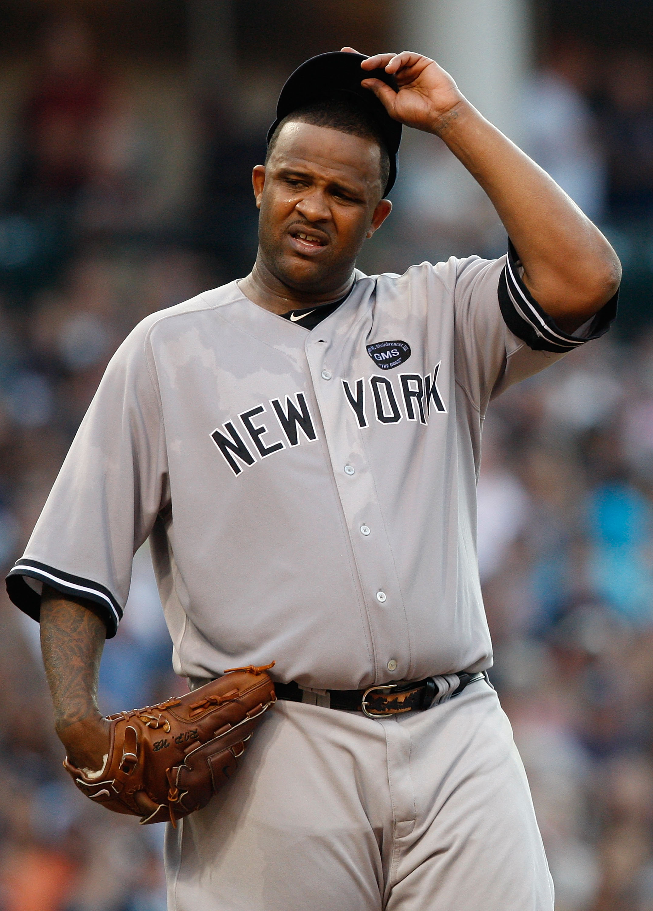 CLEVELAND - JULY 27:  CC Sabathia #52 of the New York Yankees takes a moment inbetween pitches during the game against the Cleveland Indians on July 27, 2010 at Progressive Field in Cleveland, Ohio.  (Photo by Jared Wickerham/Getty Images)