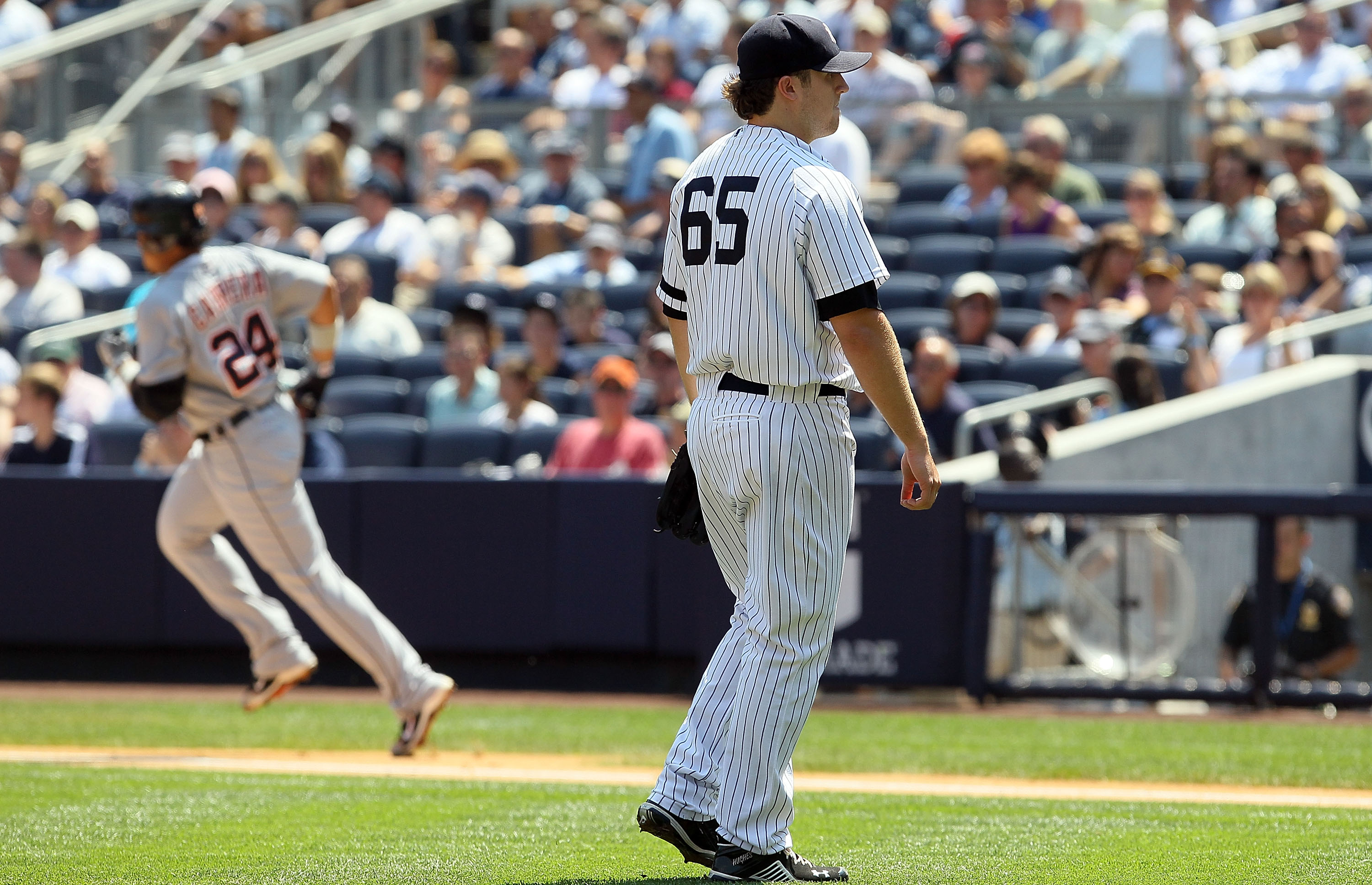 NEW YORK - AUGUST 19:  Phil Hughes #65 of the New York Yankees looks on after surrendering a first inning two run home run against Miguel Cabrera #24 of the Detroit Tigers on August 19, 2010 at Yankee Stadium in the Bronx borough of New York City.  (Photo