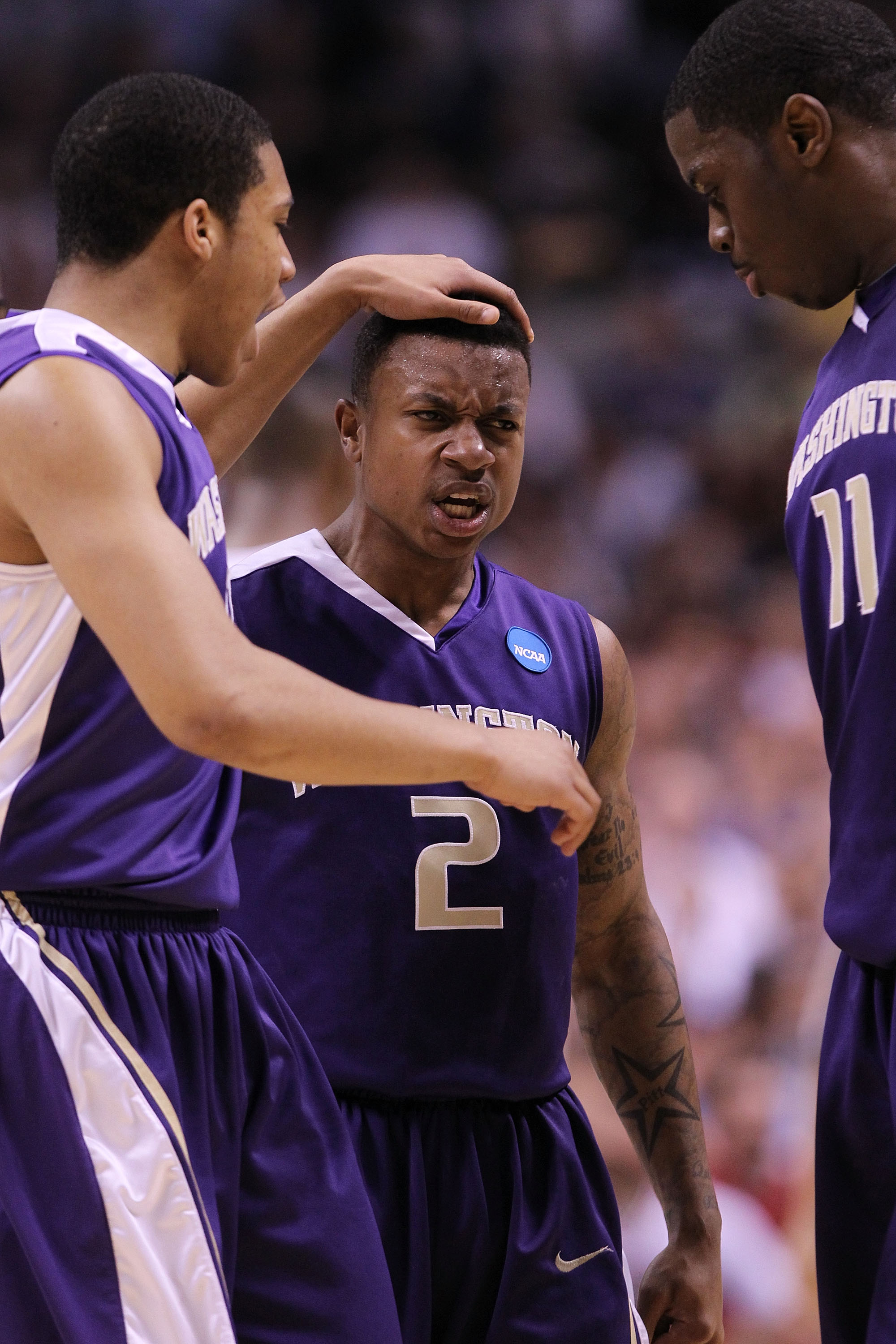 SAN JOSE, CA - MARCH 20: Guard Isaiah Thomas #2 of the Washington Huskies celebrates with Matthew Bryan-Amaning #11 and Abdul Gaddy #10 after a three point basket to give the Huskies a 10 point lead against the New Mexico Lobos in the second round of the