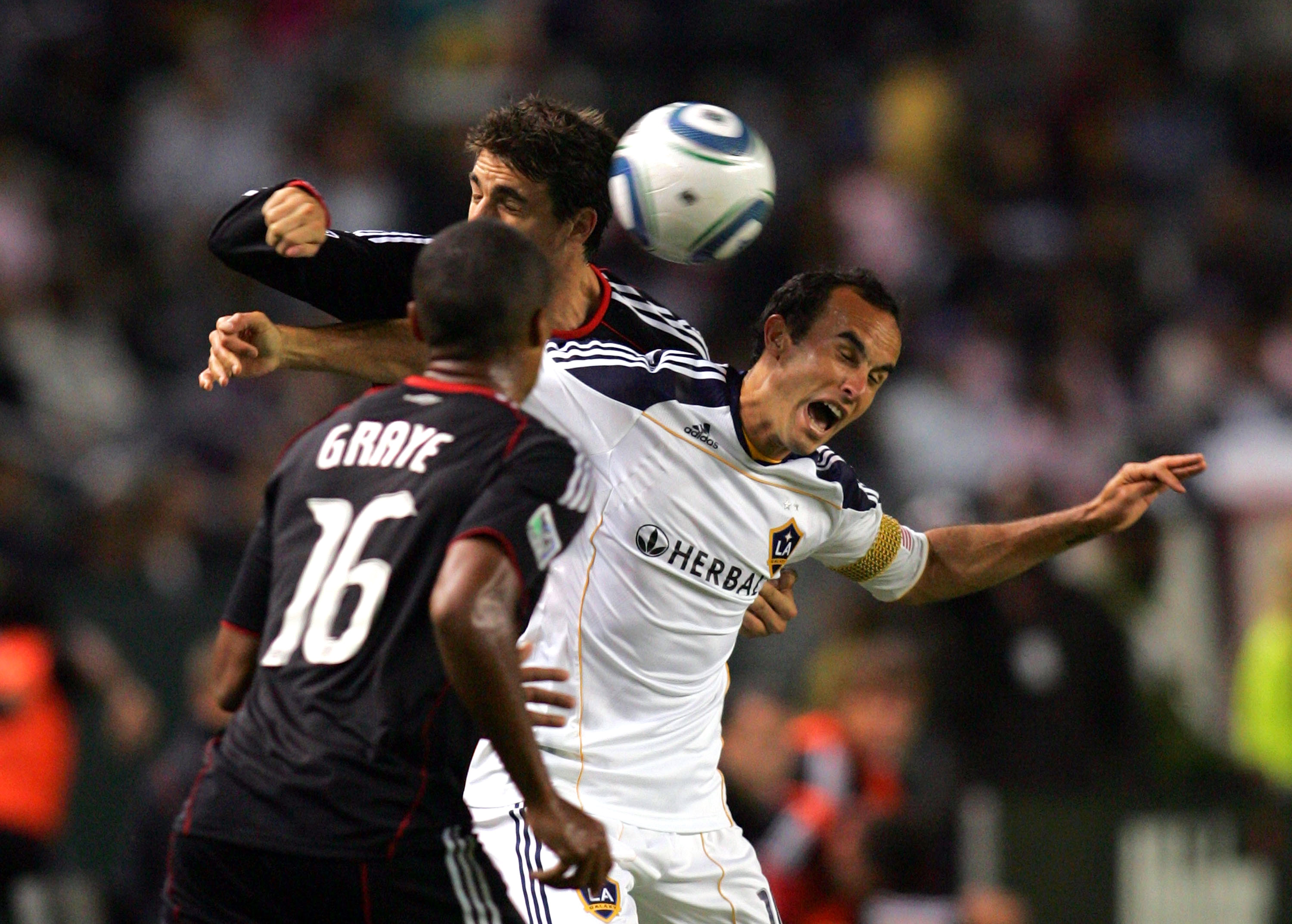 CARSON, CA - SEPTEMBER 18:  Landon Donovan #10 of the Los Angeles Galaxy and Dejan Jakovic #5 of D.C. United vie for the hight ball in the second half during the MLS match at The Home Depot Center on September 18, 2010 in Carson, California. The Galaxy de