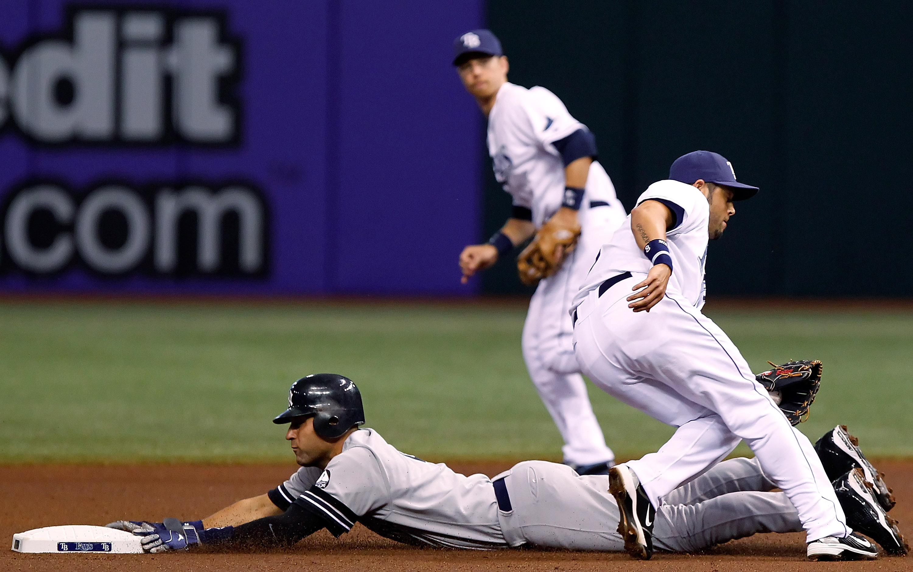 ST. PETERSBURG, FL - SEPTEMBER 15:  Shortstop Derek Jeter #2 of the New York Yankees steals second base as shortstop Jason Bartlett #8 of the Tampa Bay Rays is late with the tag during the game at Tropicana Field on September 15, 2010 in St. Petersburg, F
