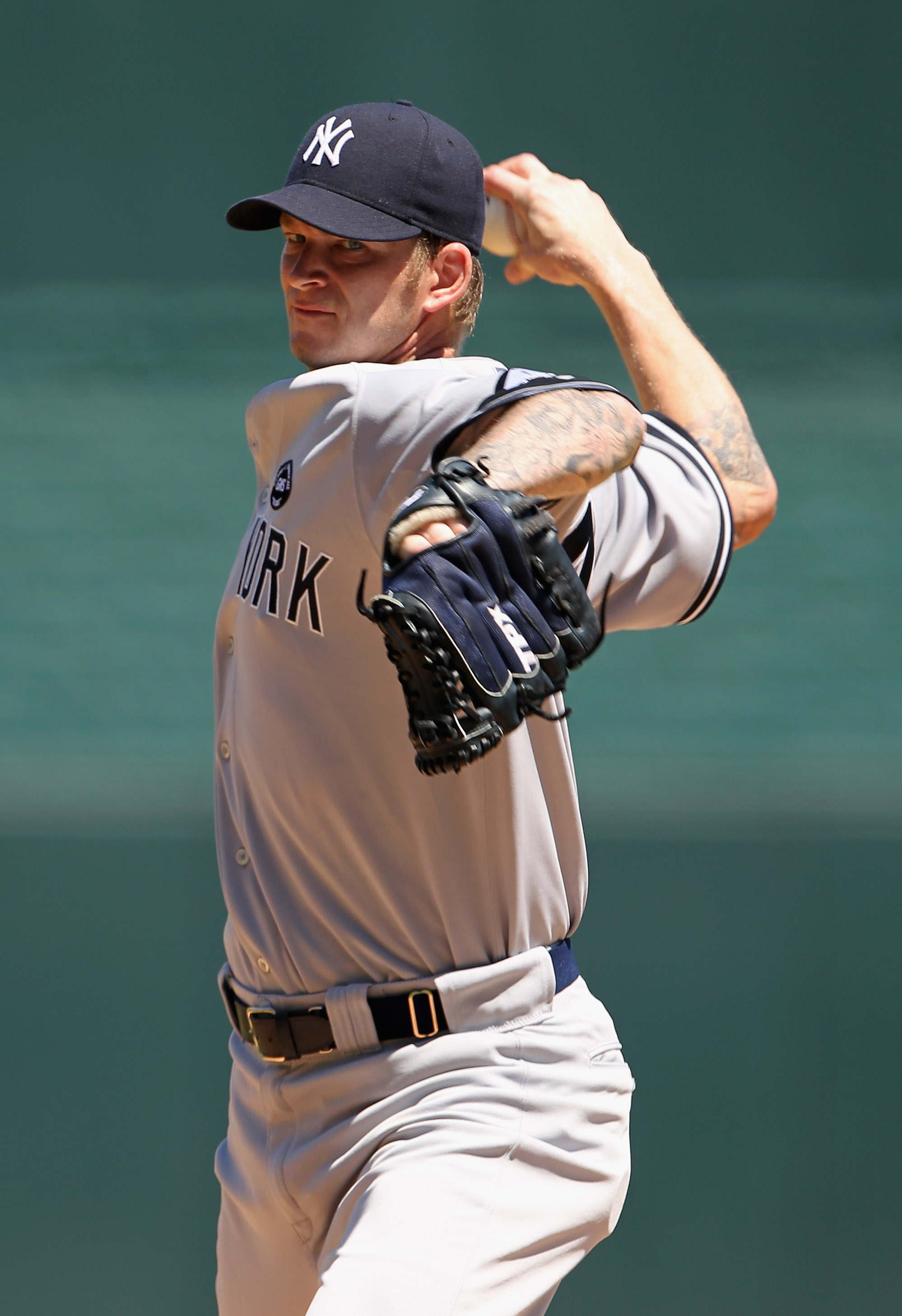 KANSAS CITY, MO - AUGUST 15:  Starting pitcher A.J. Burnett #34 of the New York Yankees in action during the game against the Kansas City Royals on August 15, 2010 at Kauffman stadium in Kansas City, Missouri.  (Photo by Jamie Squire/Getty Images)