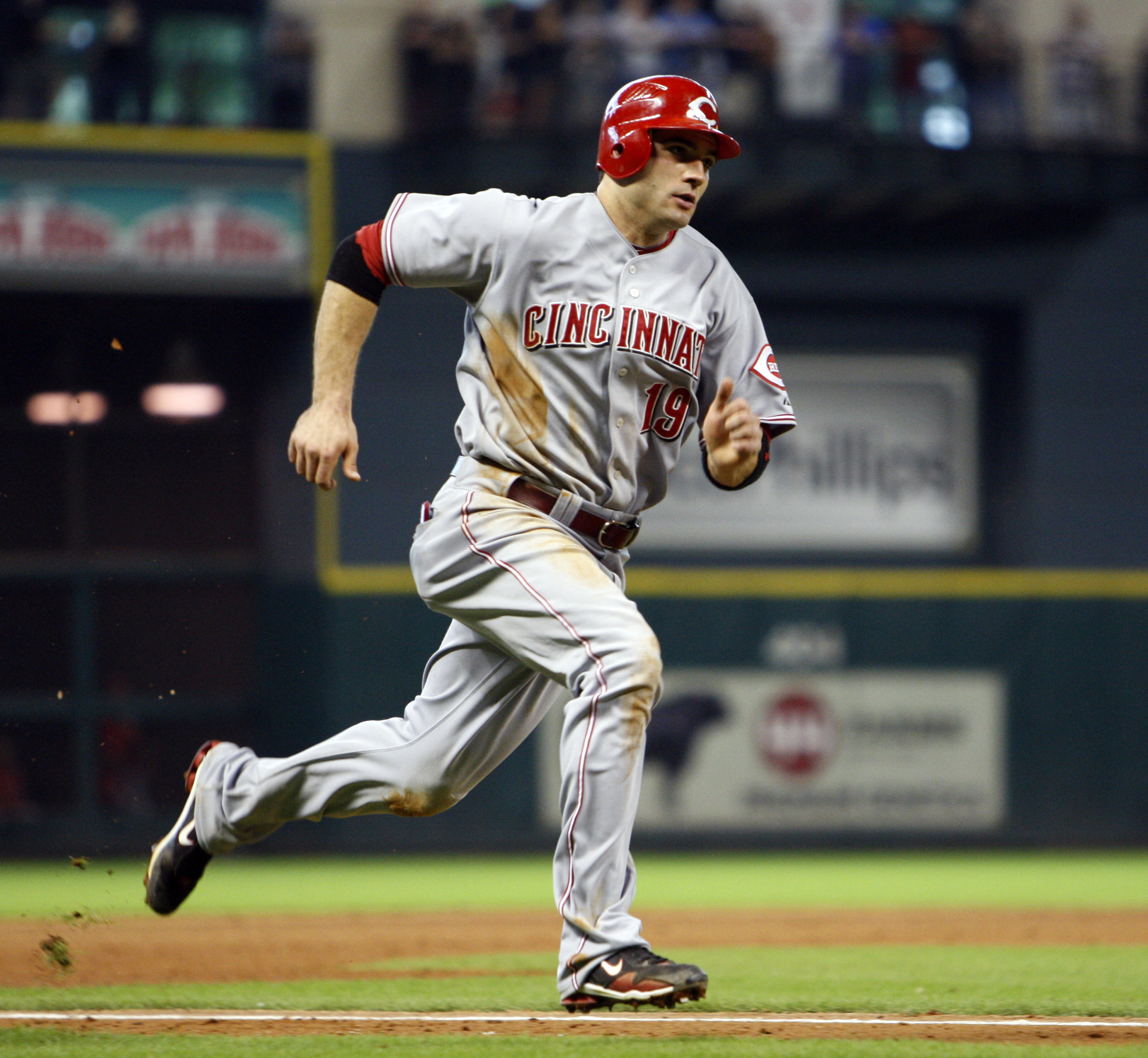 HOUSTON - SEPTEMBER 19:  Joey Votto #19 of the Cincinnatti Reds scores in the eighth inning against the Houston Astros on a single by Jay Bruce at Minute Maid  Park on September 19, 2010 in Houston, Texas.  (Photo by Bob Levey/Getty Images)