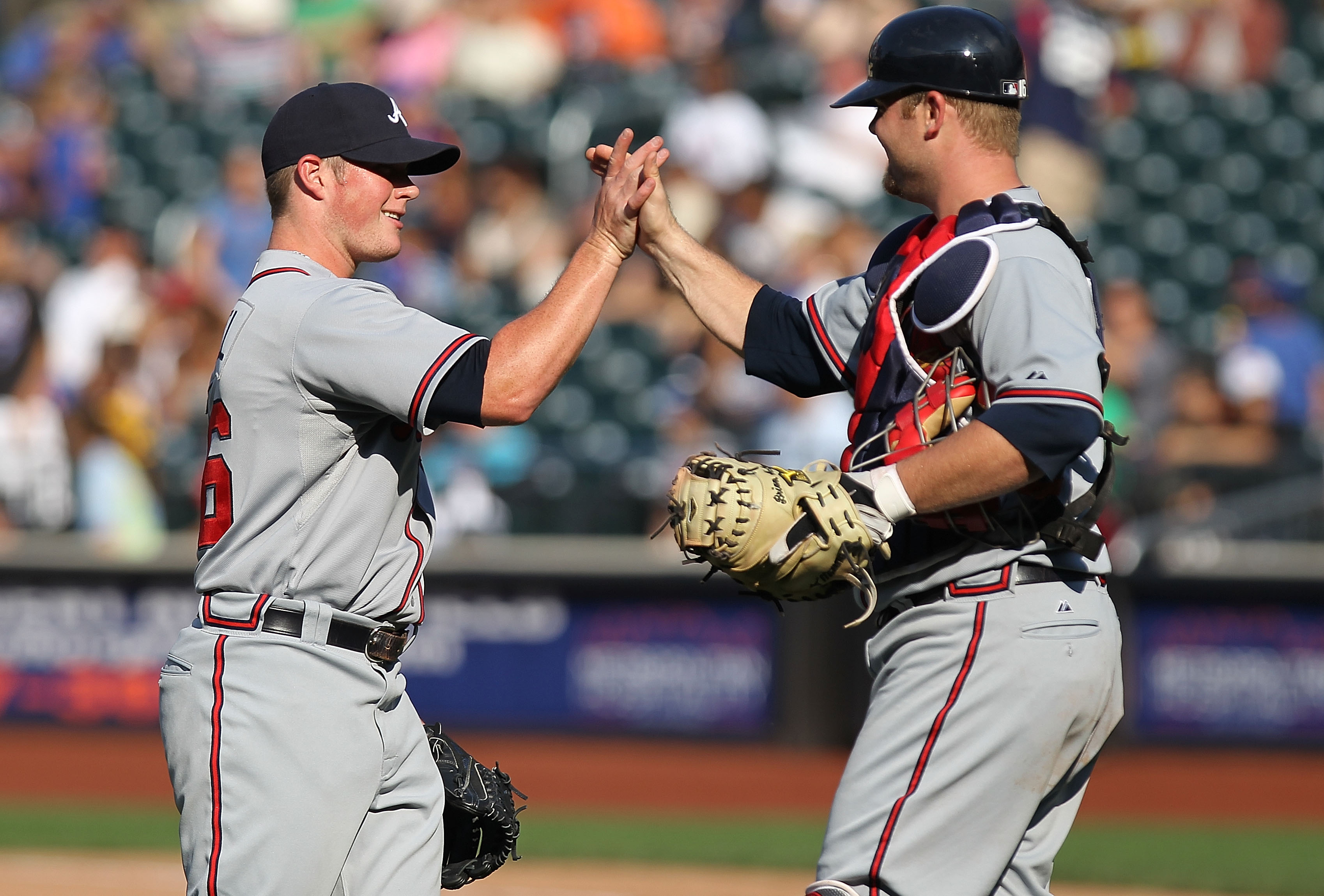 NEW YORK - SEPTEMBER 19: Craig Krimbel #46 of the Atlanta Braves celebrates the win with teammate Brian McCann #16 against the New York Mets at Citi Field on September 19, 2010 in the Flushing neighborhood of the Queens borough of New York City.  (Photo b