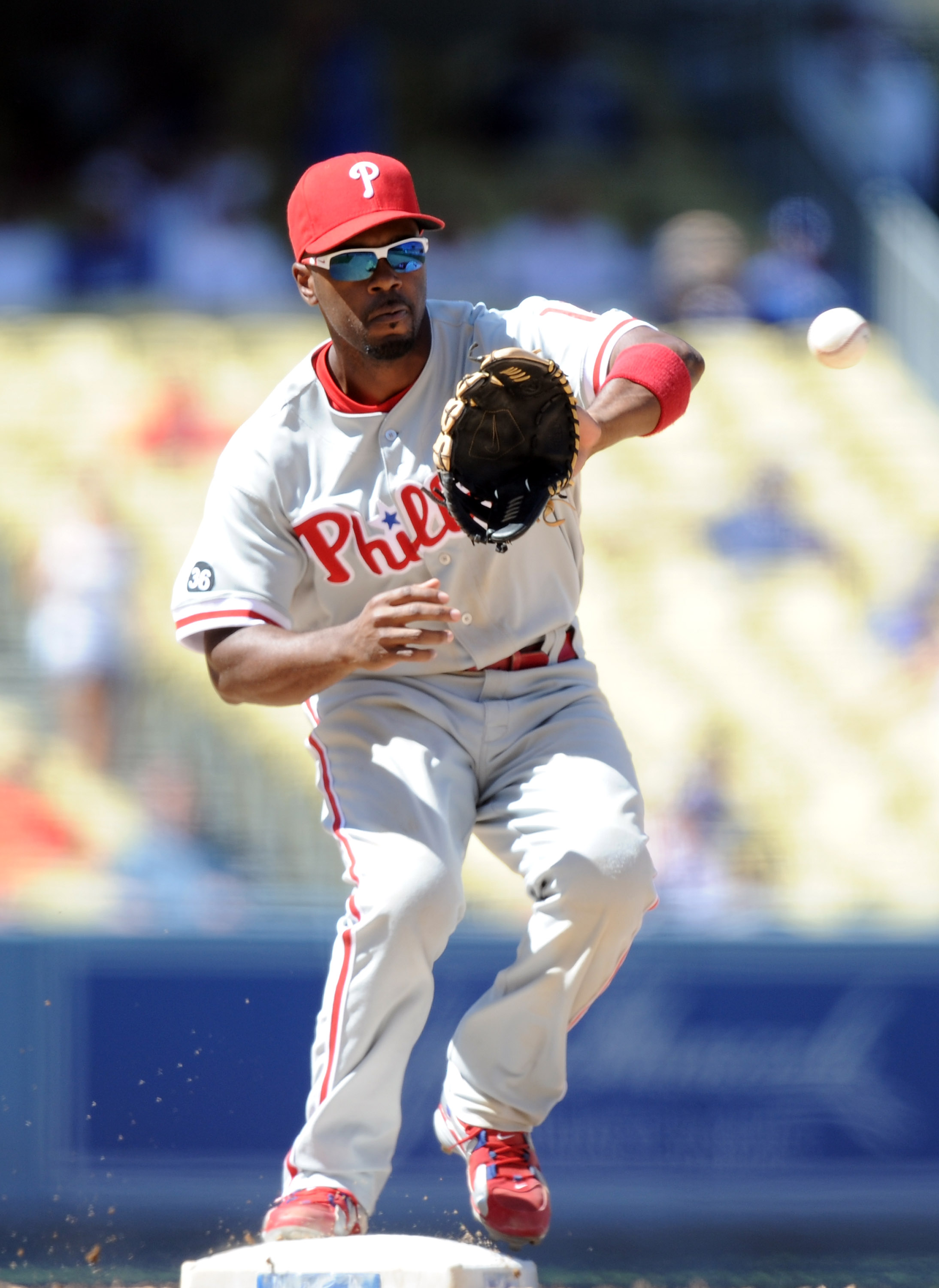 LOS ANGELES, CA - SEPTEMBER 01:  Jimmy Rollins #11 of the Philadelphia Phillies catches a throw to second base against the Los Angeles Dodgers at Dodger Stadium on September 1, 2010 in Los Angeles, California.  (Photo by Harry How/Getty Images)