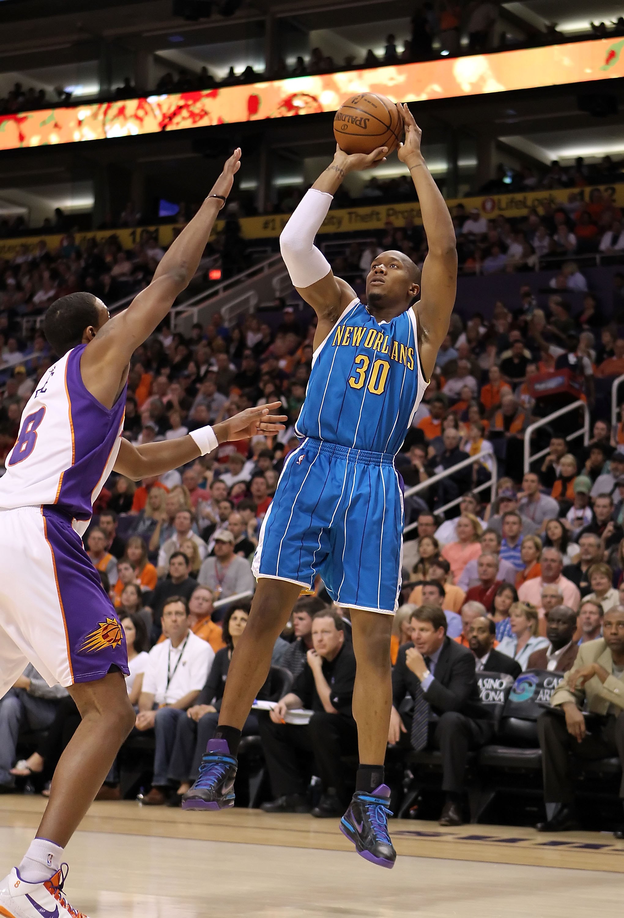 PHOENIX - MARCH 14:  David West #30 of the New Orleans Hornets puts up a shot during the NBA game against the Phoenix Suns at US Airways Center on March 14, 2010 in Phoenix, Arizona.  The Suns defeated the Hornets 120-106.  NOTE TO USER: User expressly ac