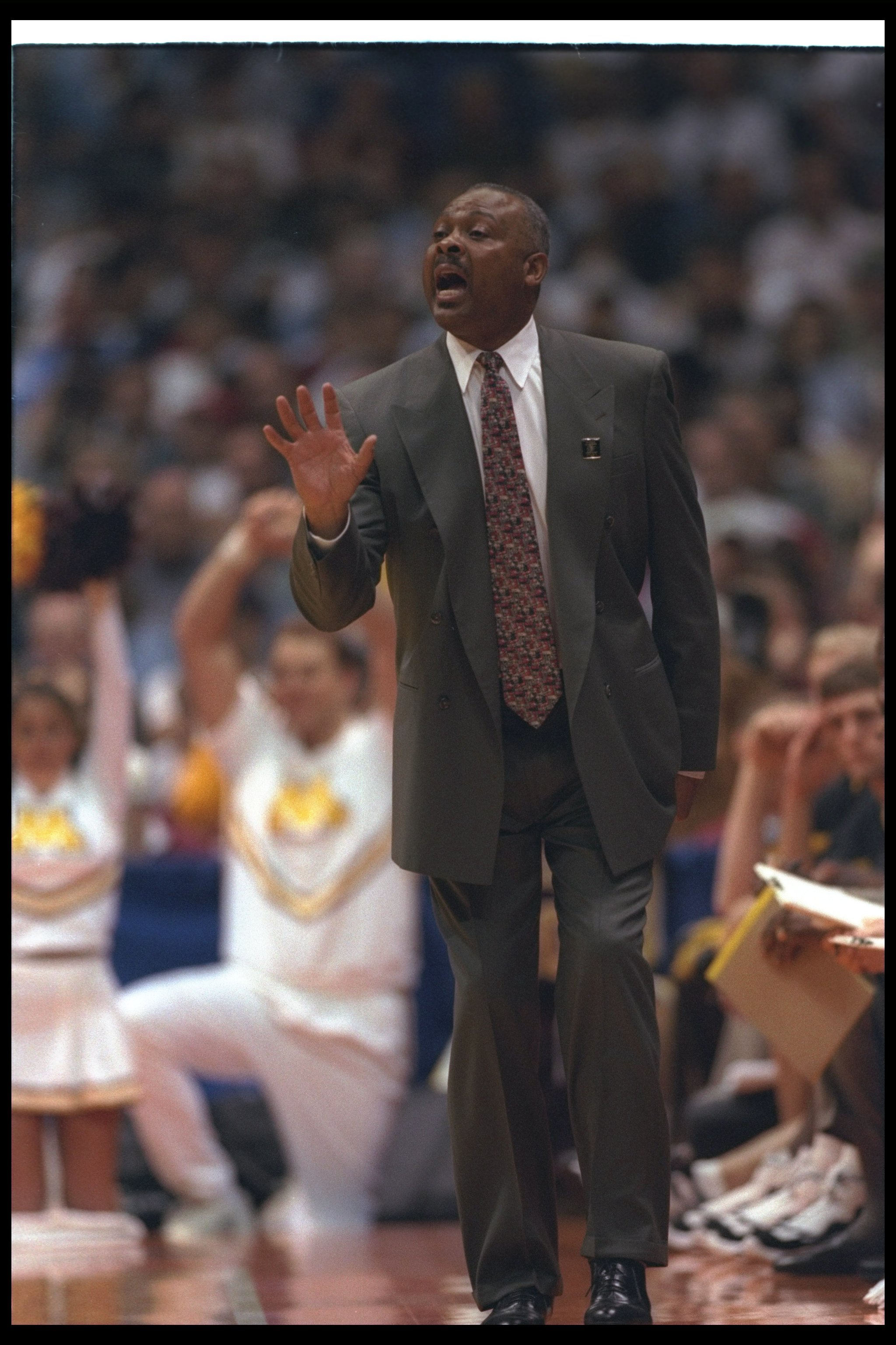 22 Mar 1997:  Coach Clem Haskins of the Minnesota Golden Gophers gives instructions to his players during a playoff game against the University of California at Los Angeles Bruins.  Minnesota won the game 80 - 72. Mandatory Credit: Stephen Dunn  /Allsport