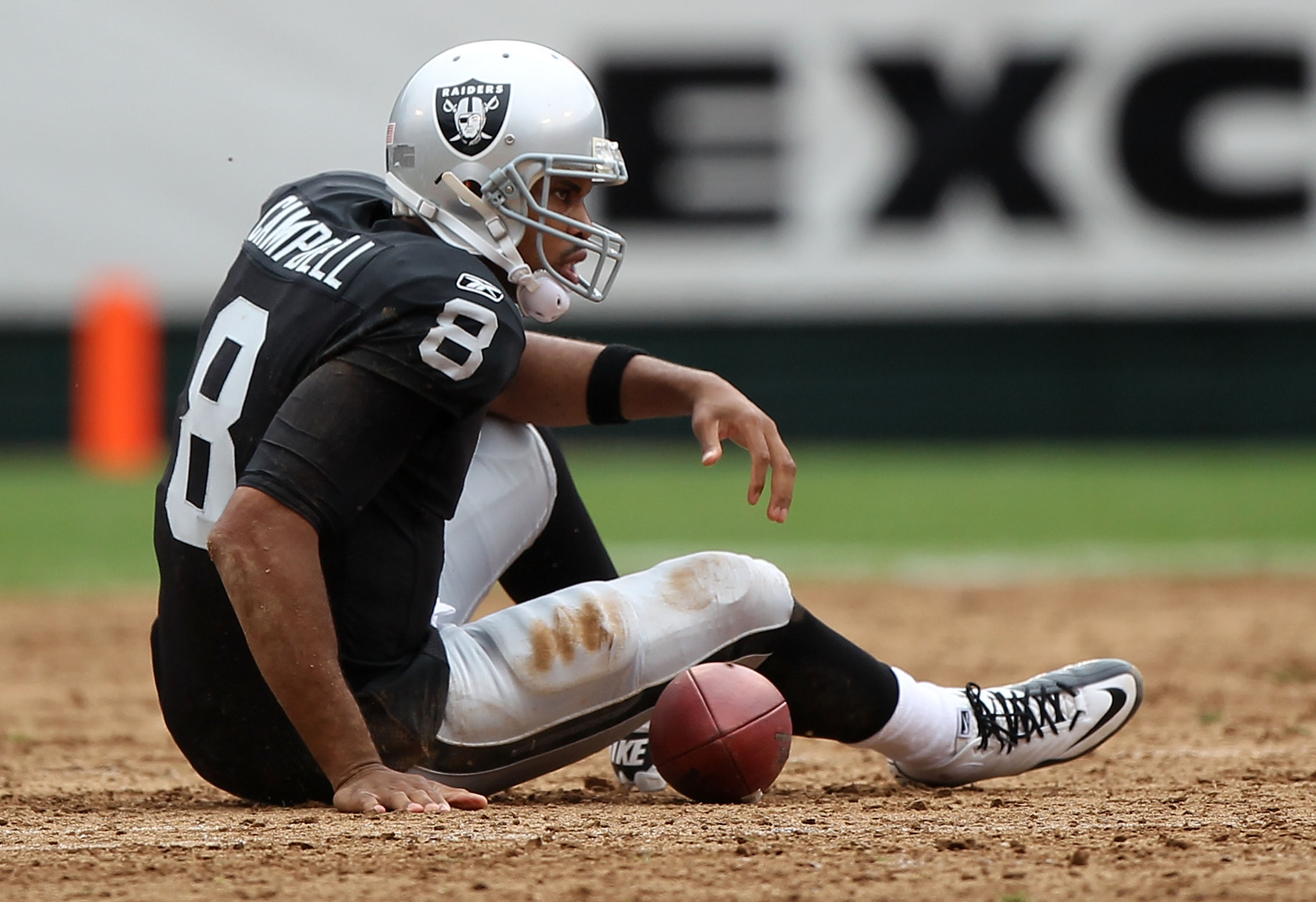 Warren Sapp of the Oakland Raiders watches from the sideline