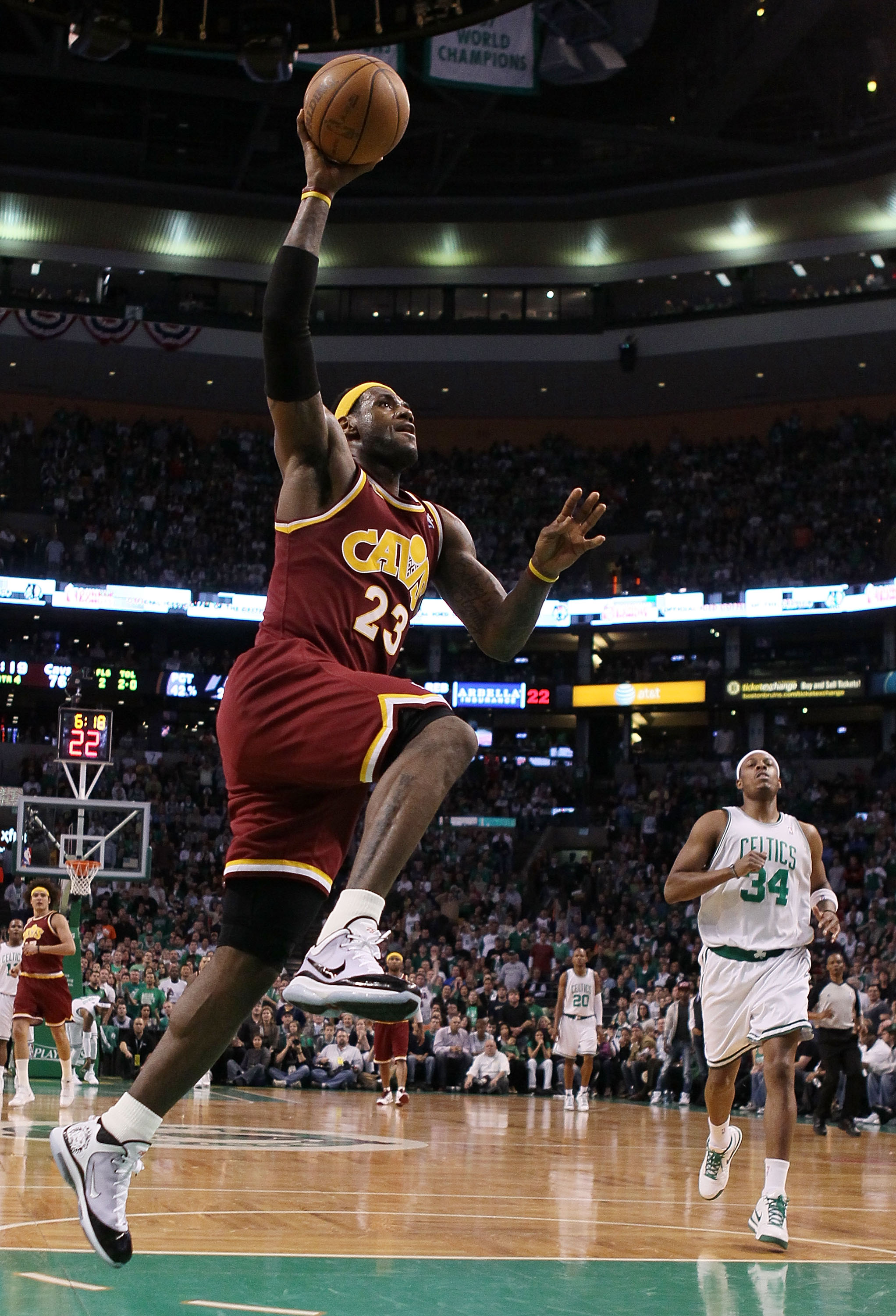 BOSTON - MAY 09:  LeBron James #23 of the Cleveland Cavaliers has a break away basket as Paul Pierce #34 of the Boston Celtics defends during Game Four of the Eastern Conference Semifinals of the 2010 NBA playoffs at TD Garden on May 9, 2010 in Boston, Ma