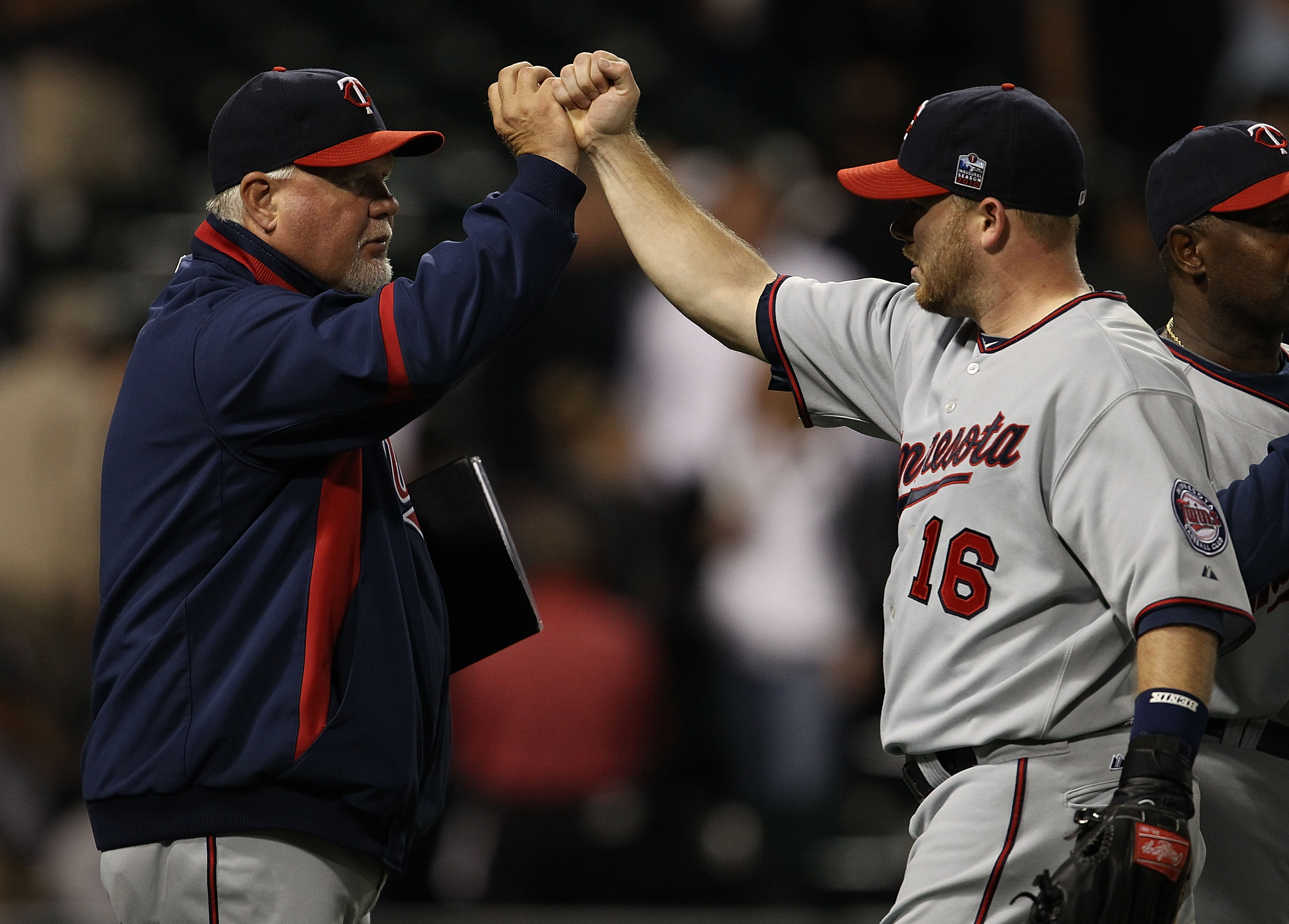CHICAGO - SEPTEMBER 14: Manager Ron Gardenhire #35 of the Minnesota Twins congratulates Jason Kubel #16 after a win over the Chicago White Sox at U.S. Cellular Field on September 14, 2010 in Chicago, Illinois. The Twins defeated the White Sox 9-3. (Photo