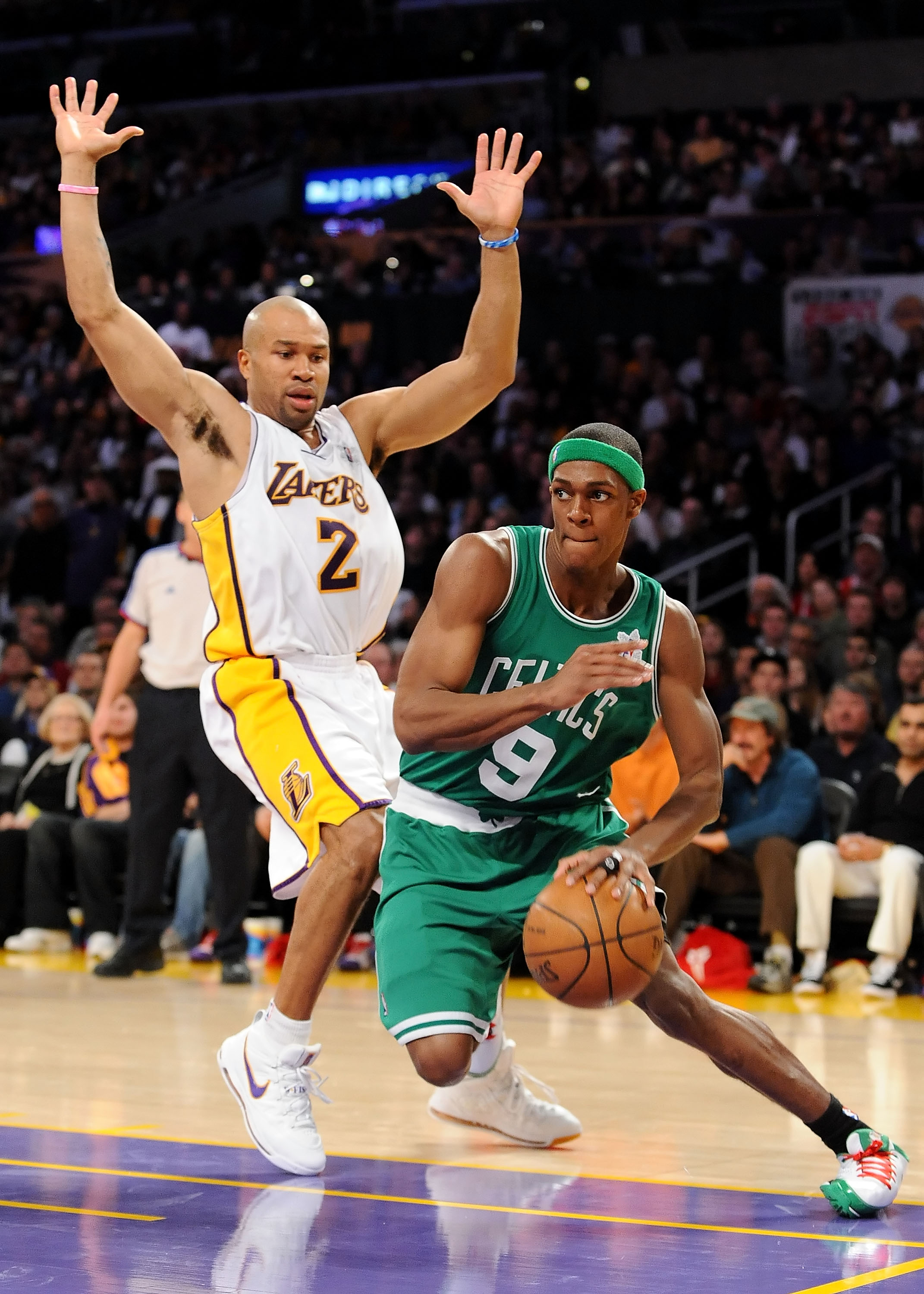 LOS ANGELES, CA - DECEMBER 25:   Rajon Rondo #9 of the Boston Celtics drives to the basket against Derek Fisher #2 of the Los Angeles Lakers at Staples Center on December 25, 2008 in Los Angeles, California.  The Lakers defeated the Celtics 92-83.  NOTE T
