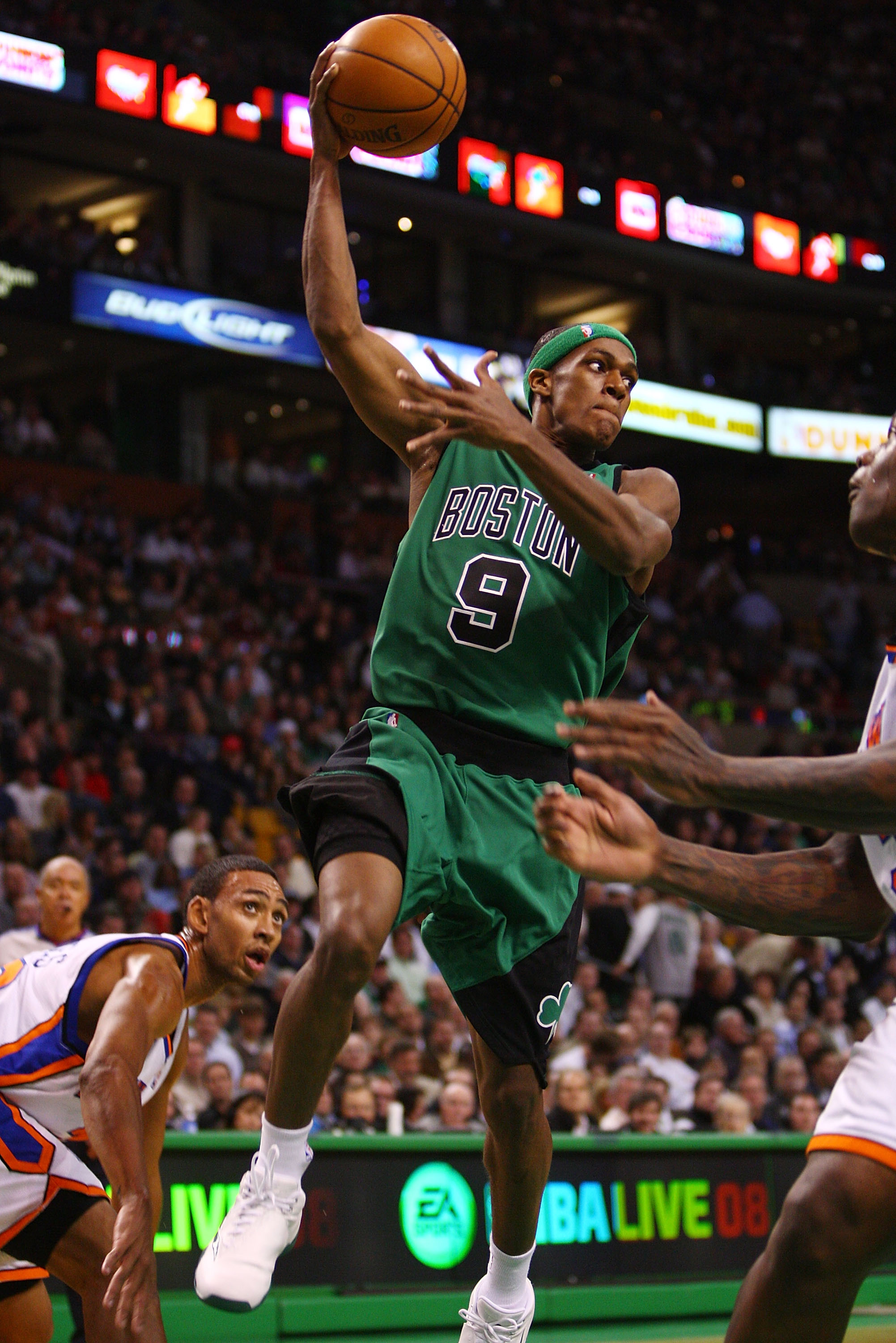 BOSTON - NOVEMBER 29:  Rajon Rondo #9 of the Boston Celtics passes the ball as Jared Jeffries #20 of the New York Knicks defends at the TD Banknorth Garden November 29, 2007 in Boston, Massachusetts.  NOTE TO USER: User expressly acknowledges and agrees t