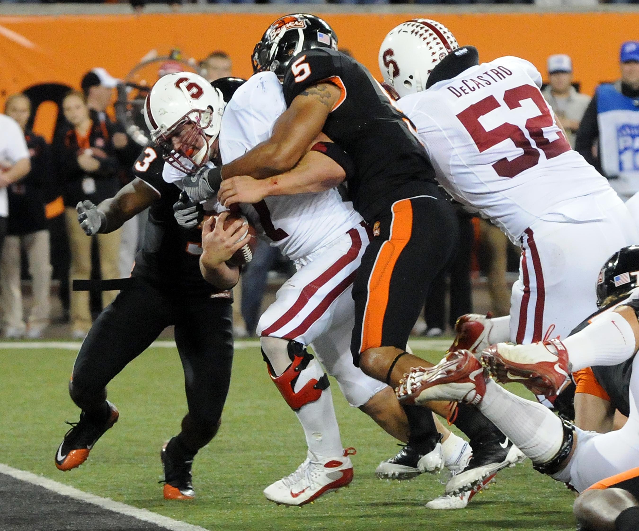 CORVALLIS, OR - OCTOBER 10: Running back Toby Gerhart #7 of the Stanford Cardinals drags safety Cameron Collins #5 of the Oregon State Beavers into the end zone as he scores a touchdown in the fourth quarter of the game at Reser Stadium on October 10, 200