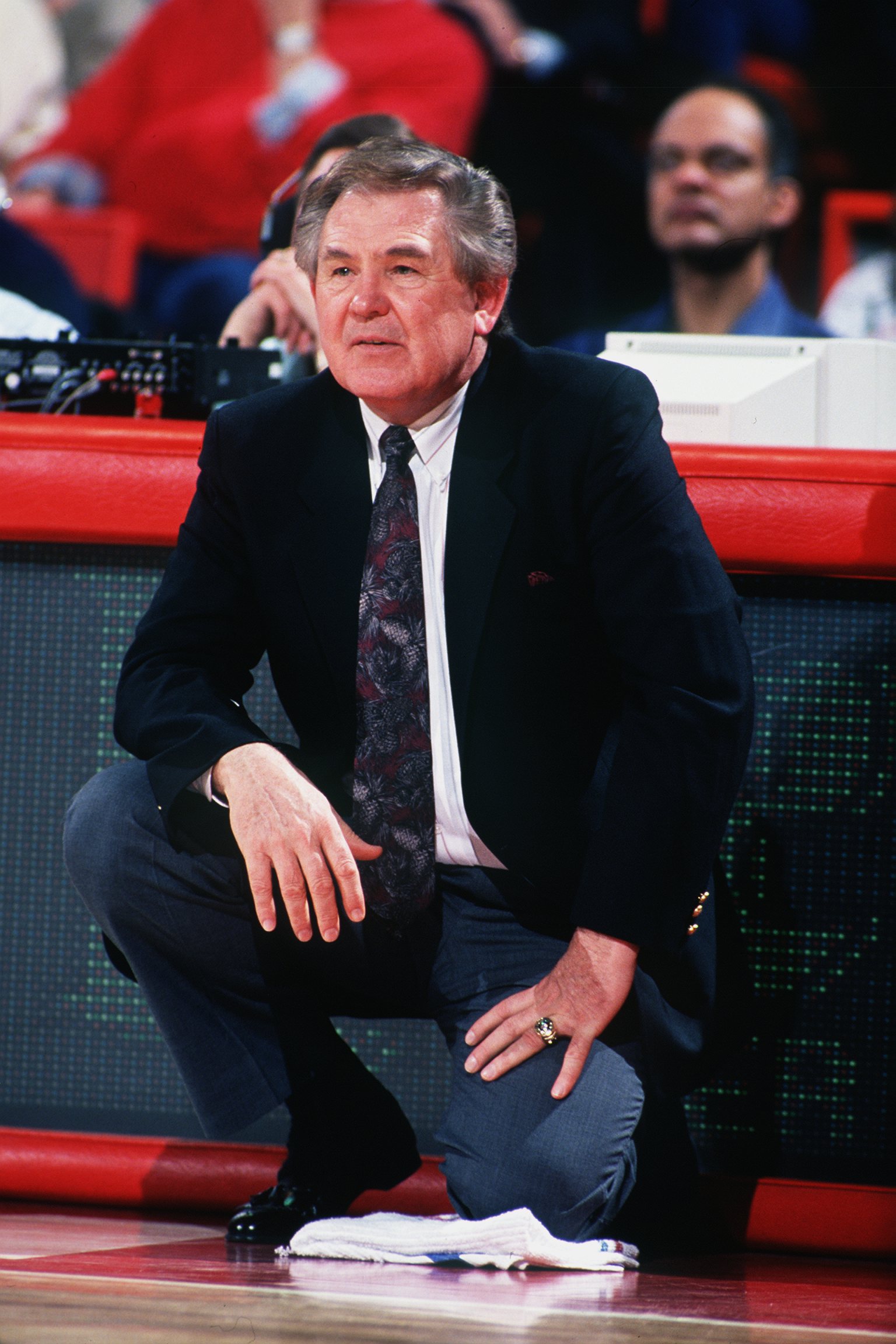 1992:  NEW JERSEY HEAD COACH BILL FITCH KNEELS ON THE SIDELINE DURING THE NETS GAME VERSUS THE DENVER NUGGETS. Mandatory Credit: Tim Defrisco/ALLSPORT