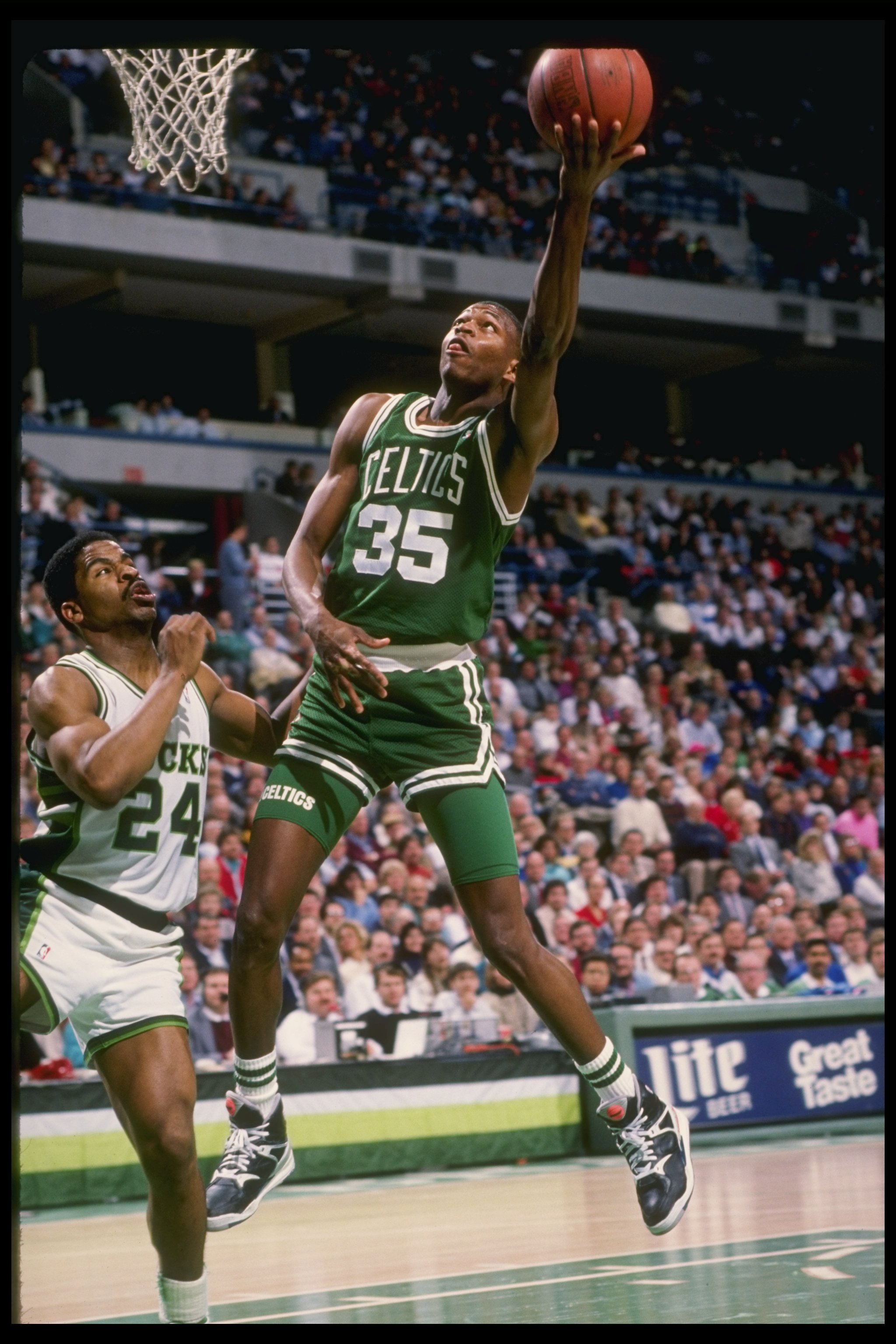 Guard Reggie Lewis of the Boston Celtics lays up the ball during a game against the Milwaukee Bucks at the Bradley Center in Milwaukee, Wisconsin.
