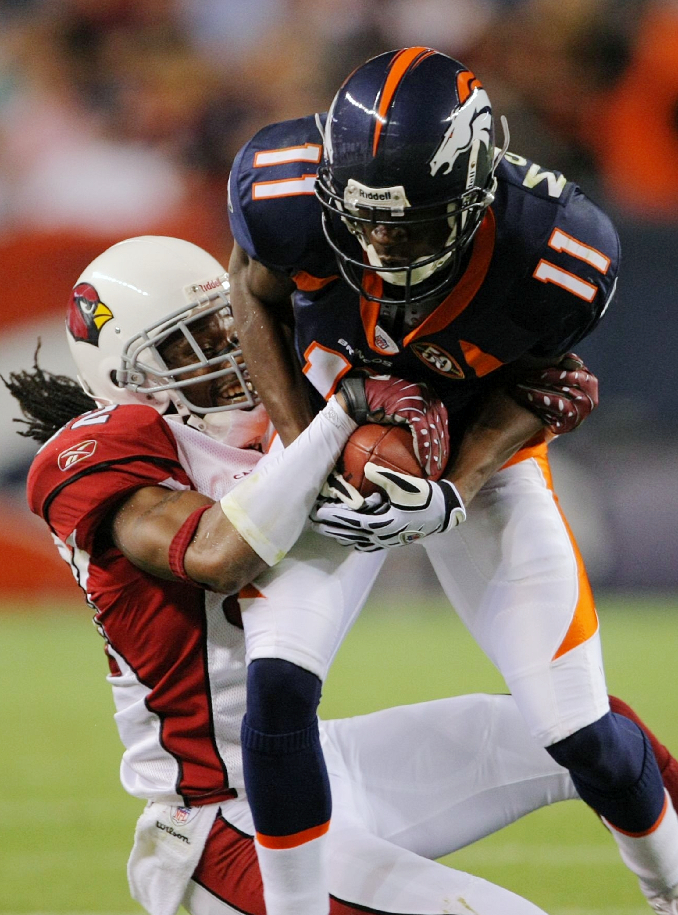 Denver Broncos wide receiver Kenny McKinley (11) is tackled by