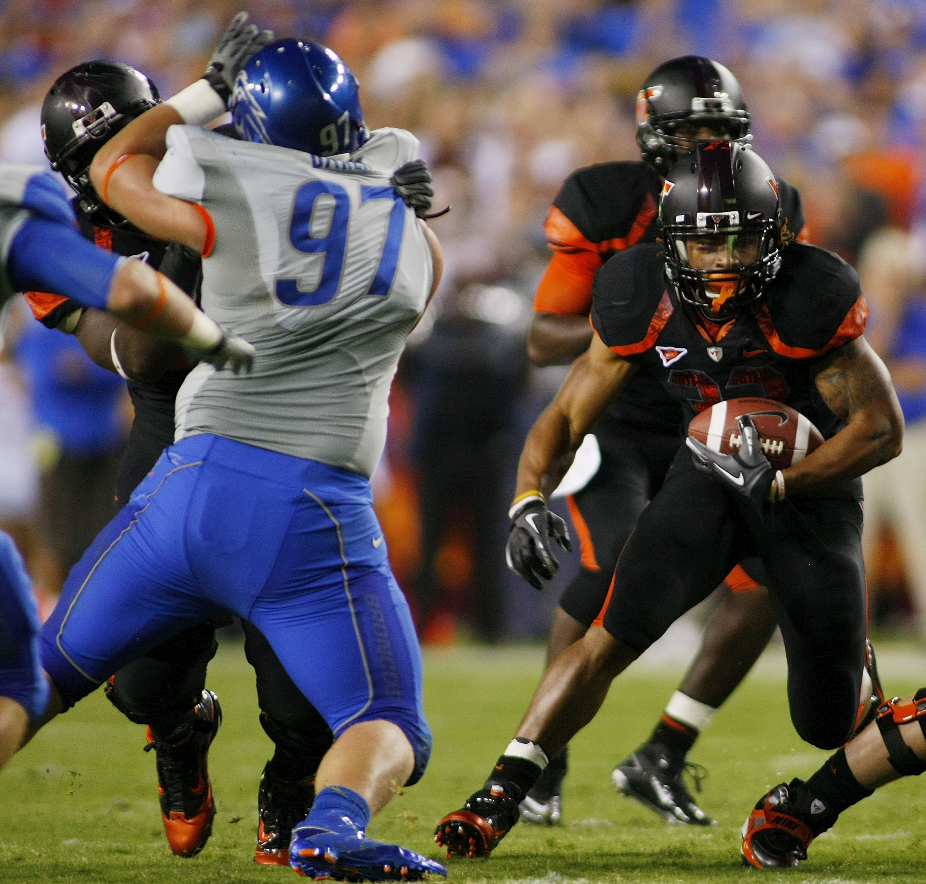 LANDOVER, MD - SEPTEMBER 06: Running back Darren Evans #32 of the Virginia Tech Hokies runs with the ball past defensive end Chase Baker #97 of the Boise State Broncos at FedExField on September 6, 2010 in Landover, Maryland. (Photo by Geoff Burke/Getty