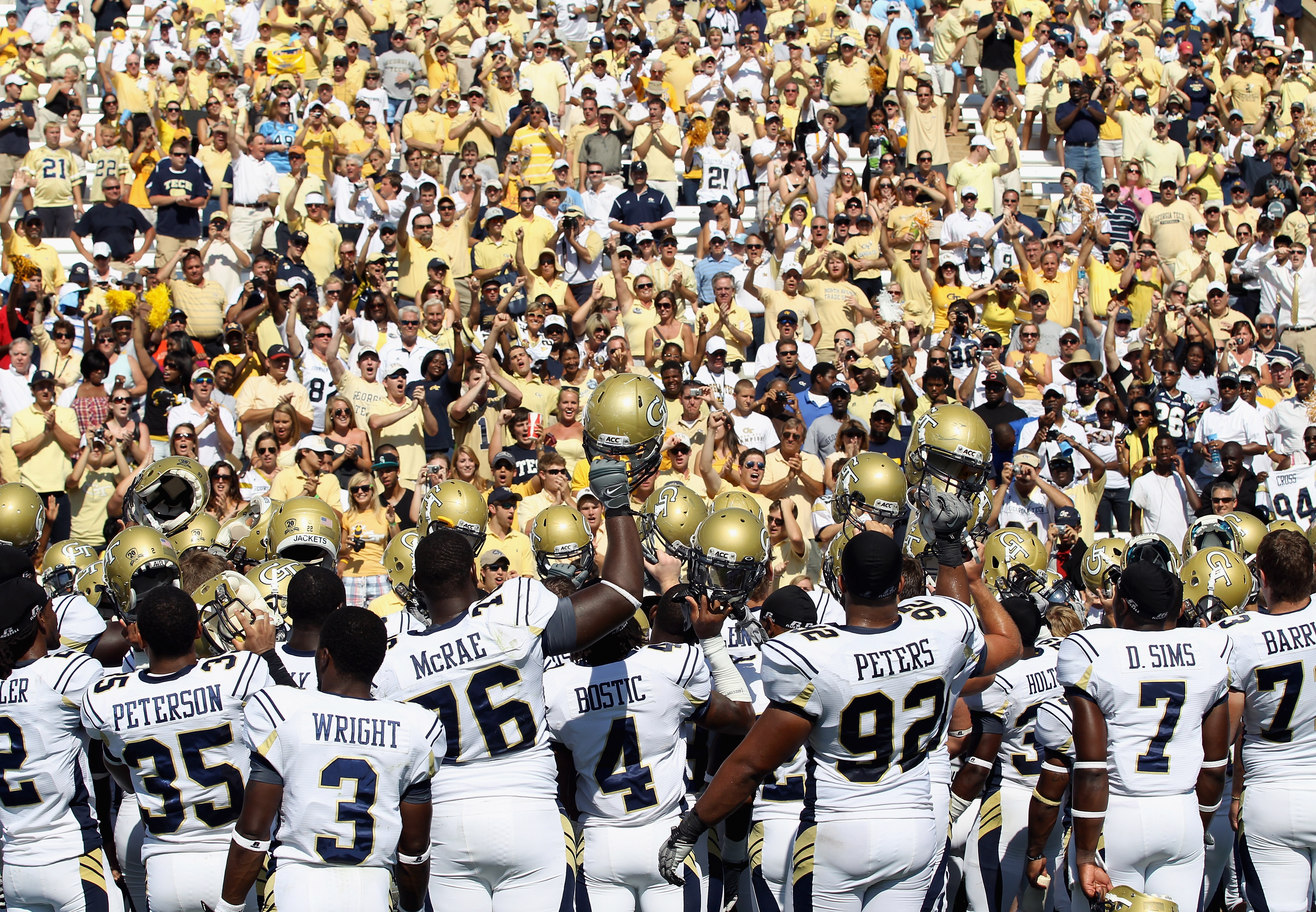 CHAPEL HILL, NC - SEPTEMBER 18: The Georgia Tech Yellow Jackets celebrate with fans after defeating the North Carolina Tar Heels during their game at Kenan Stadium on September 18, 2010 in Chapel Hill, North Carolina. (Photo by Streeter Lecka/Getty Imag