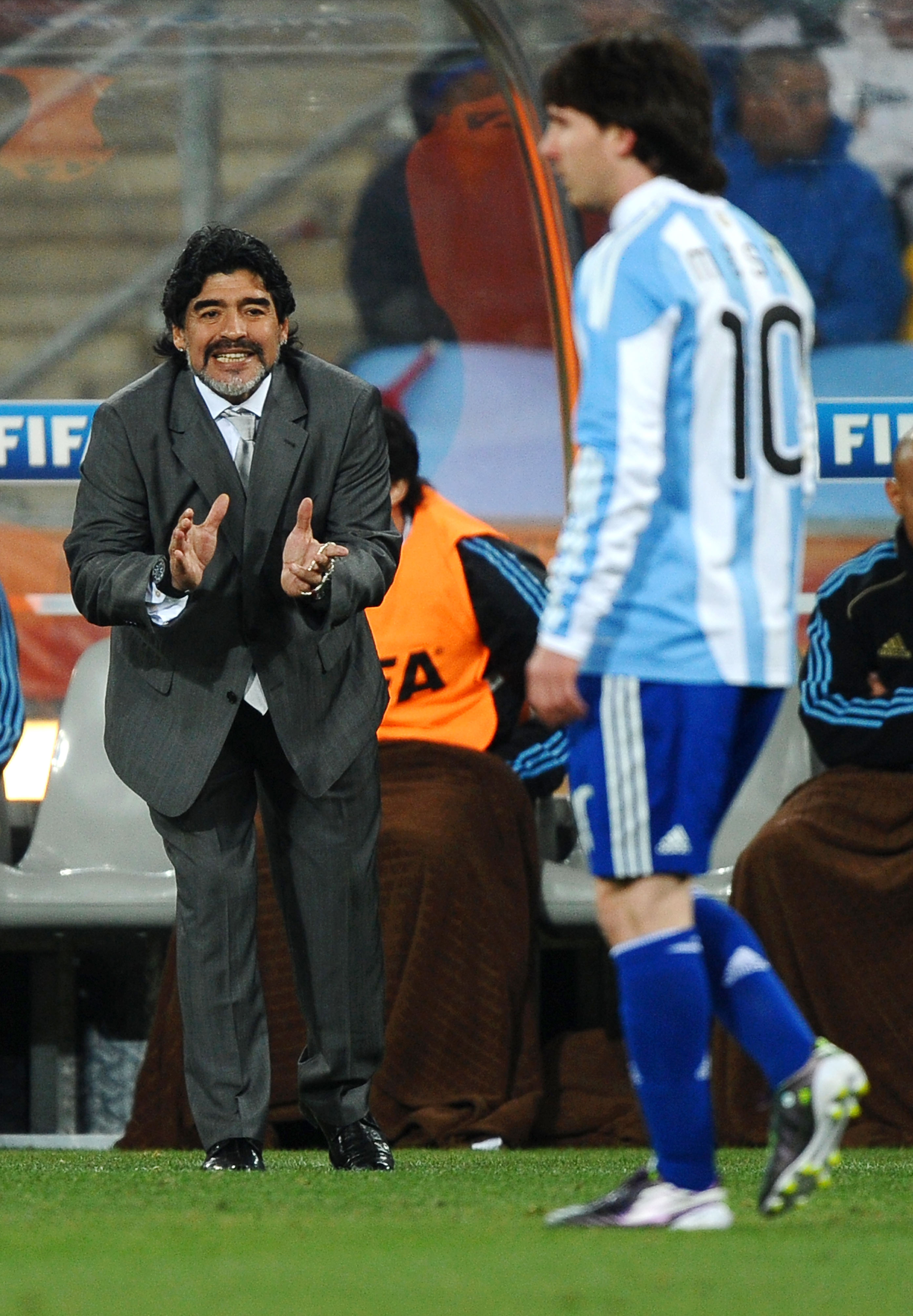 JOHANNESBURG, SOUTH AFRICA - JUNE 27:  Diego Maradona head coach of Argentina gestures as Lionel Messi walks past during the 2010 FIFA World Cup South Africa Round of Sixteen match between Argentina and Mexico at Soccer City Stadium on June 27, 2010 in Jo