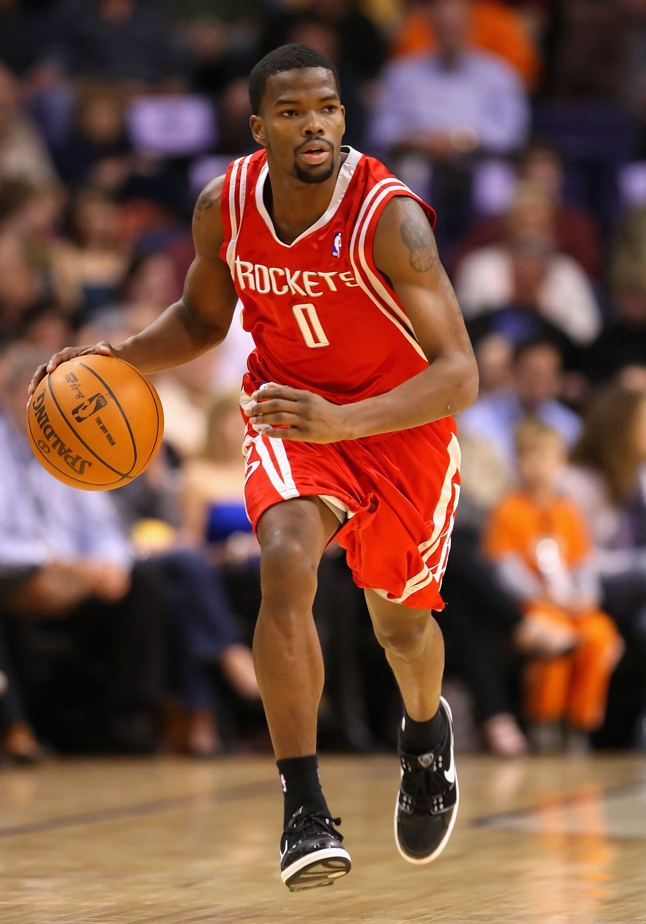 PHOENIX - JANUARY 06:  Aaron Brooks #0 of the Houston Rockets handles the ball during the NBA game against the Phoenix Suns at US Airways Center on January 6, 2010 in Phoenix, Arizona. The Suns defeated the Rockets 118-110.  NOTE TO USER: User expressly a
