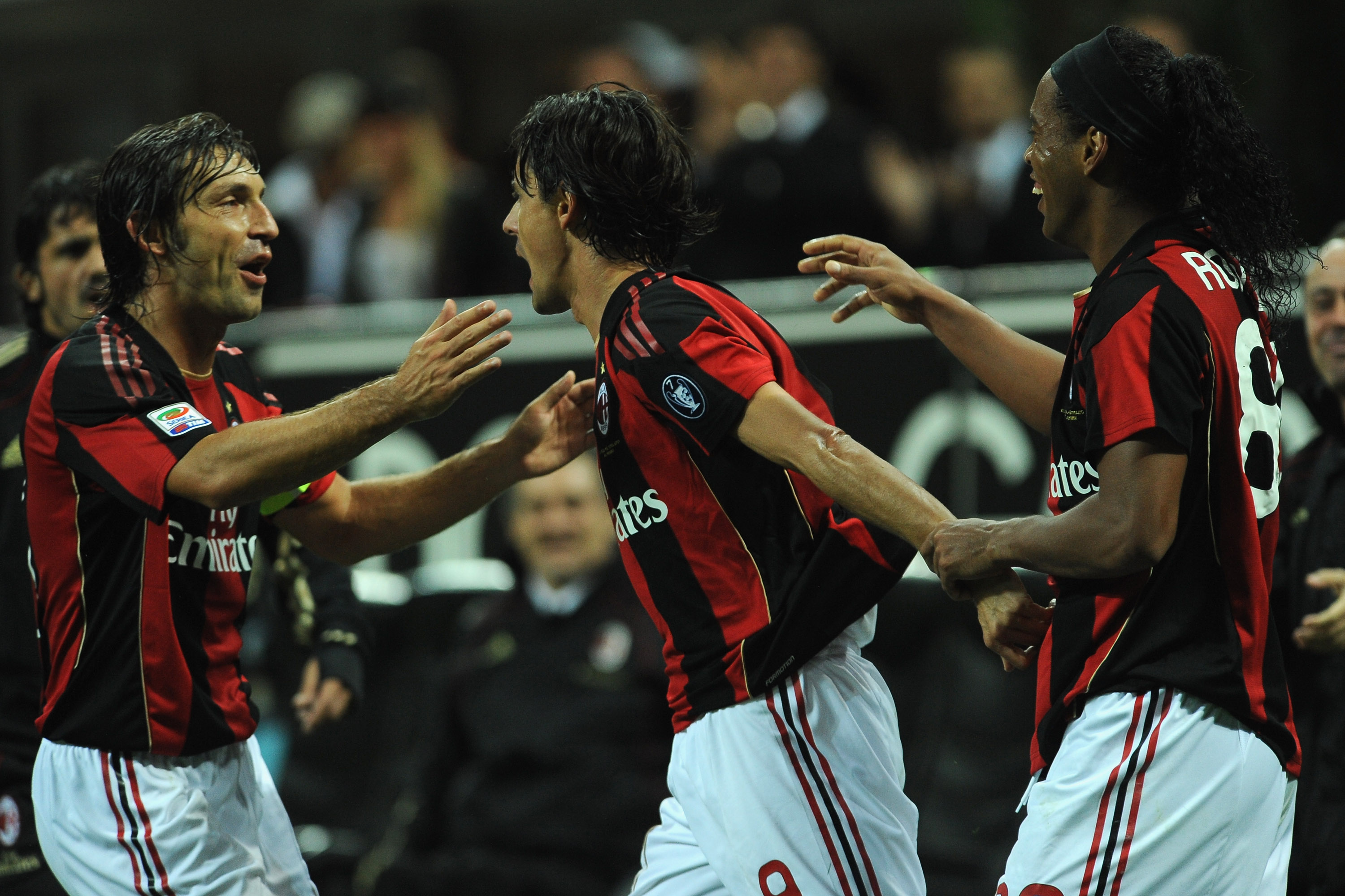 MILAN, ITALY - SEPTEMBER 18:  Filippo Inzaghi (C) of AC Milan celebrates his goal with Andrea Pirlo (L) and Ronaldinho (R) during the Serie A match between AC Milan and Catania Calcio at Stadio Giuseppe Meazza on September 18, 2010 in Milan, Italy.  (Phot