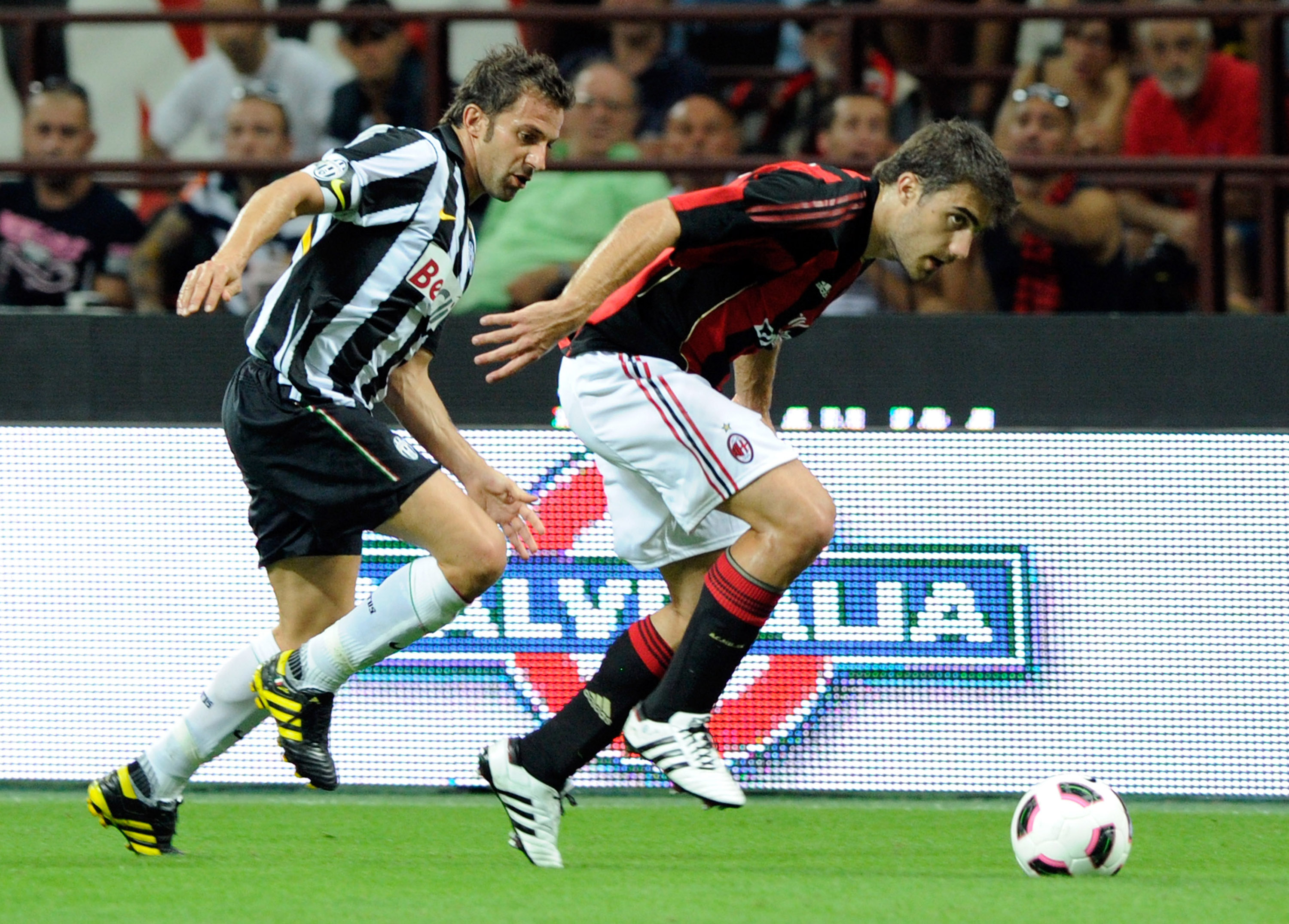 MILAN, ITALY - AUGUST 22:  Sokratis Papasthatopoulos of AC Milan and Alessandro Del Piero of Juventus FC in action during the Berlusconi Trophy match between Milan and Juventus at Giuseppe Meazza Stadium on August 22, 2010 in Milan, Italy.  (Photo by Clau